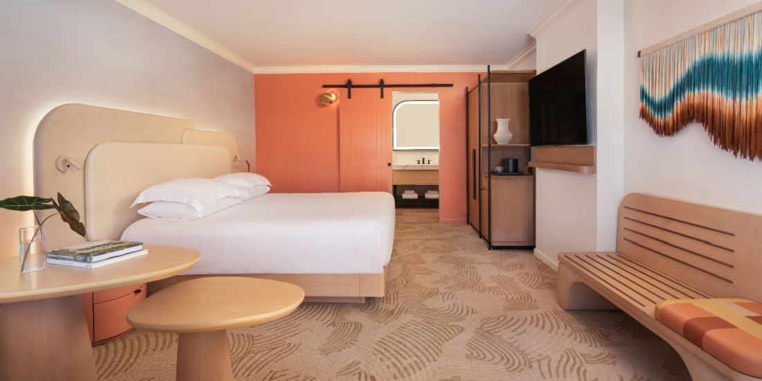Guestroom decorated in desert colors at Kimpton MIrabel Resort & Villas