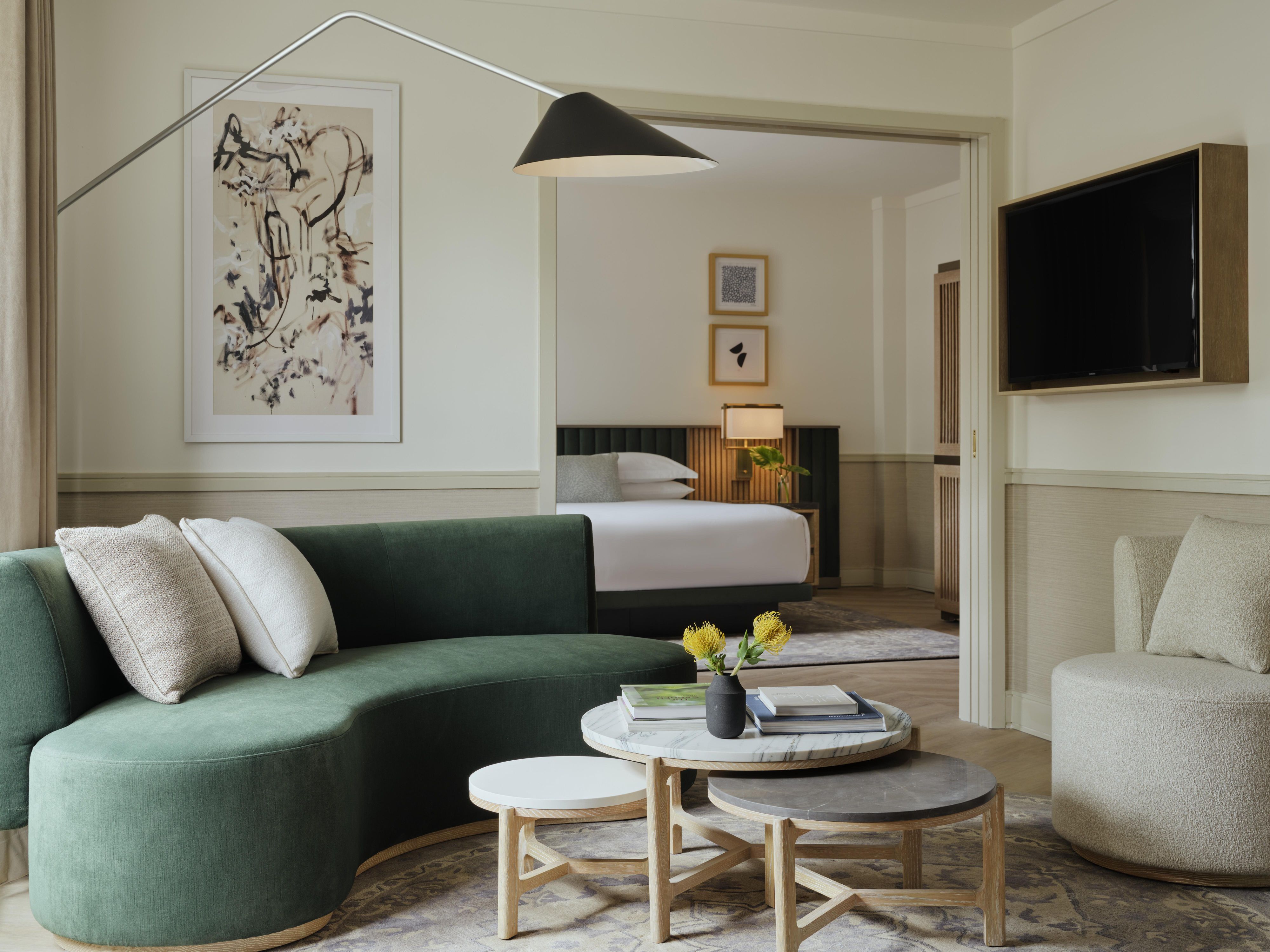 Modern hotel suite with chic lounge and serene bedroom