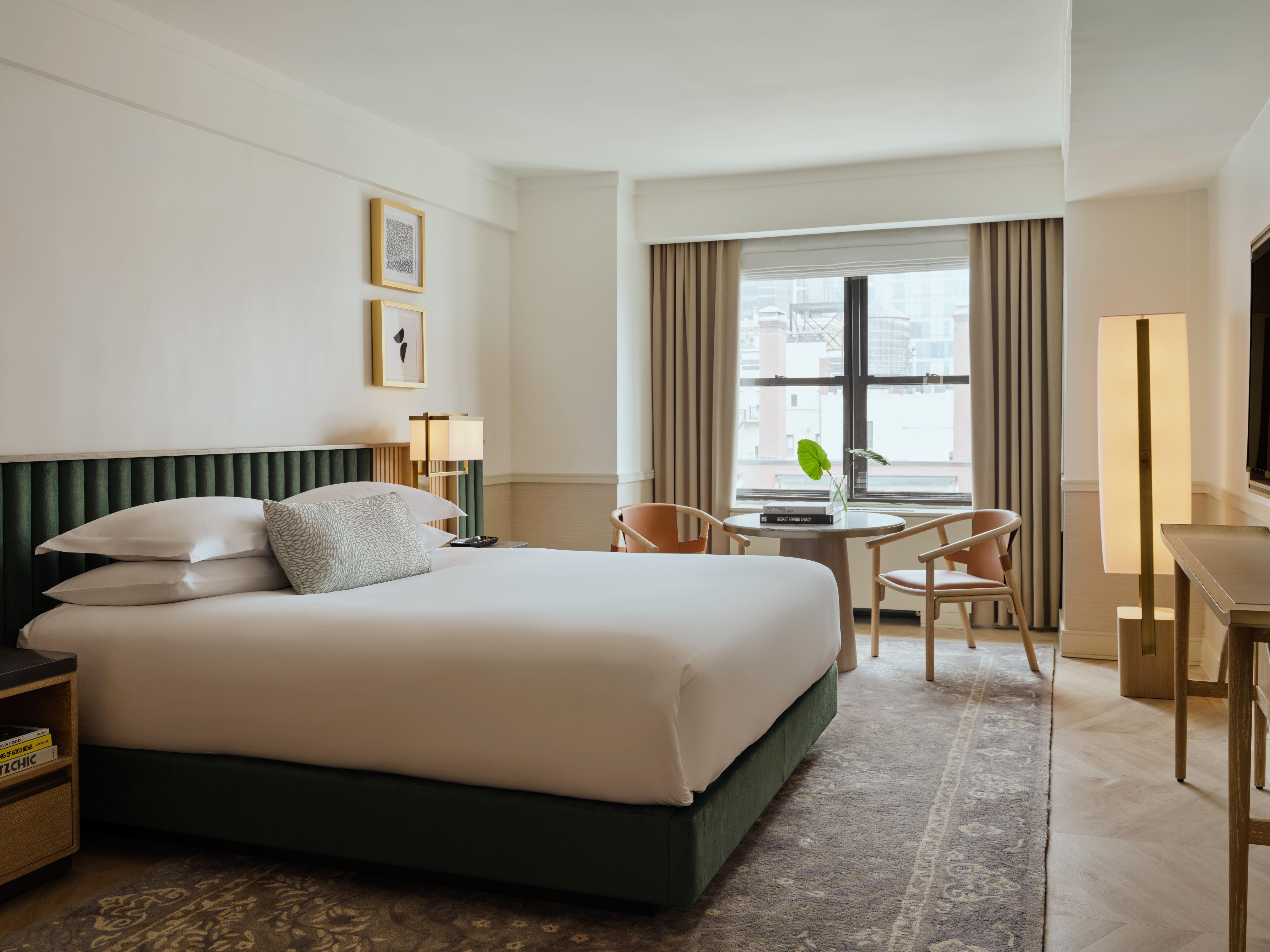 Spacious king room with elegant bedding and Park Avenue views