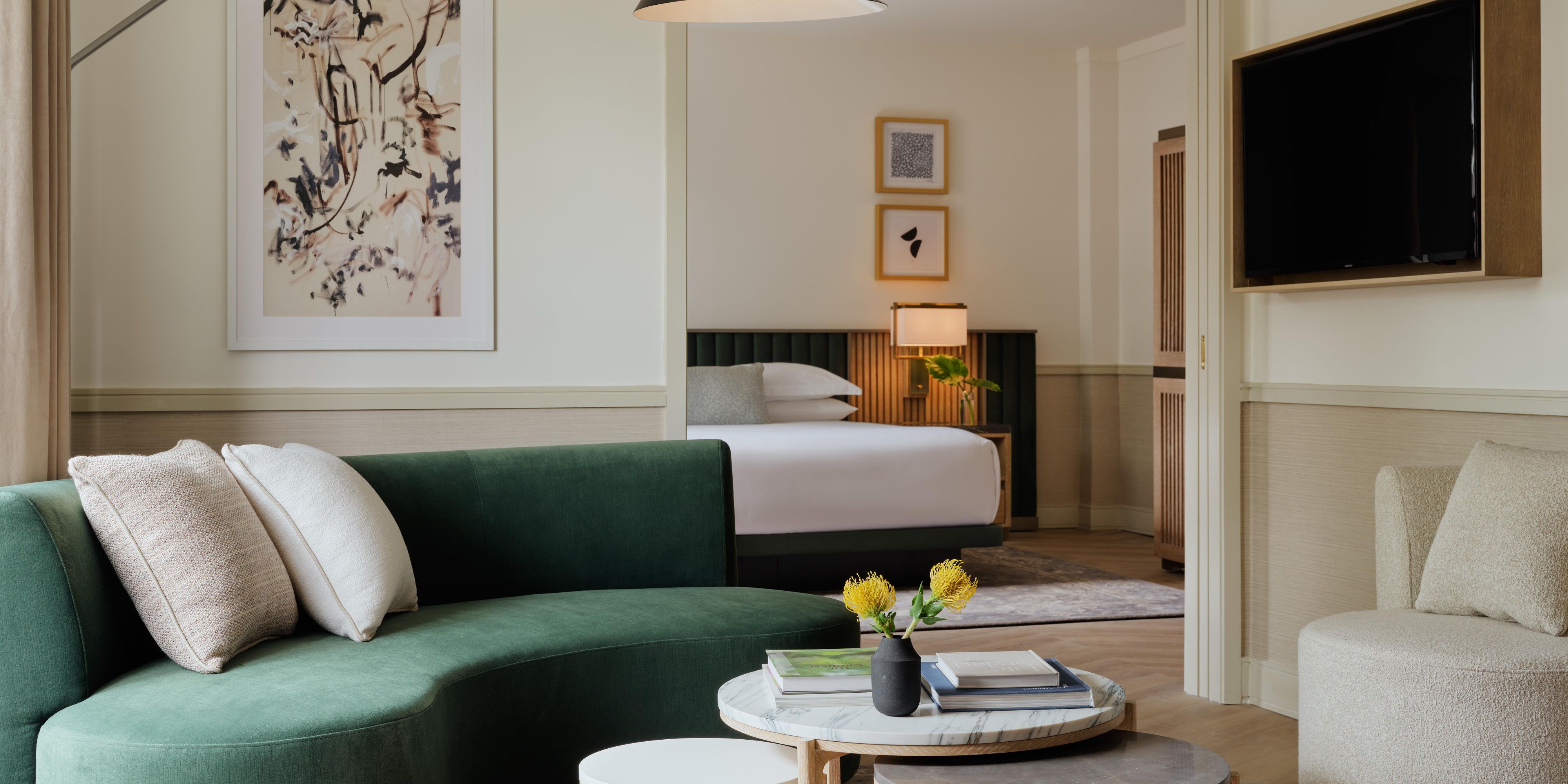 Modern hotel suite with chic lounge and serene bedroom