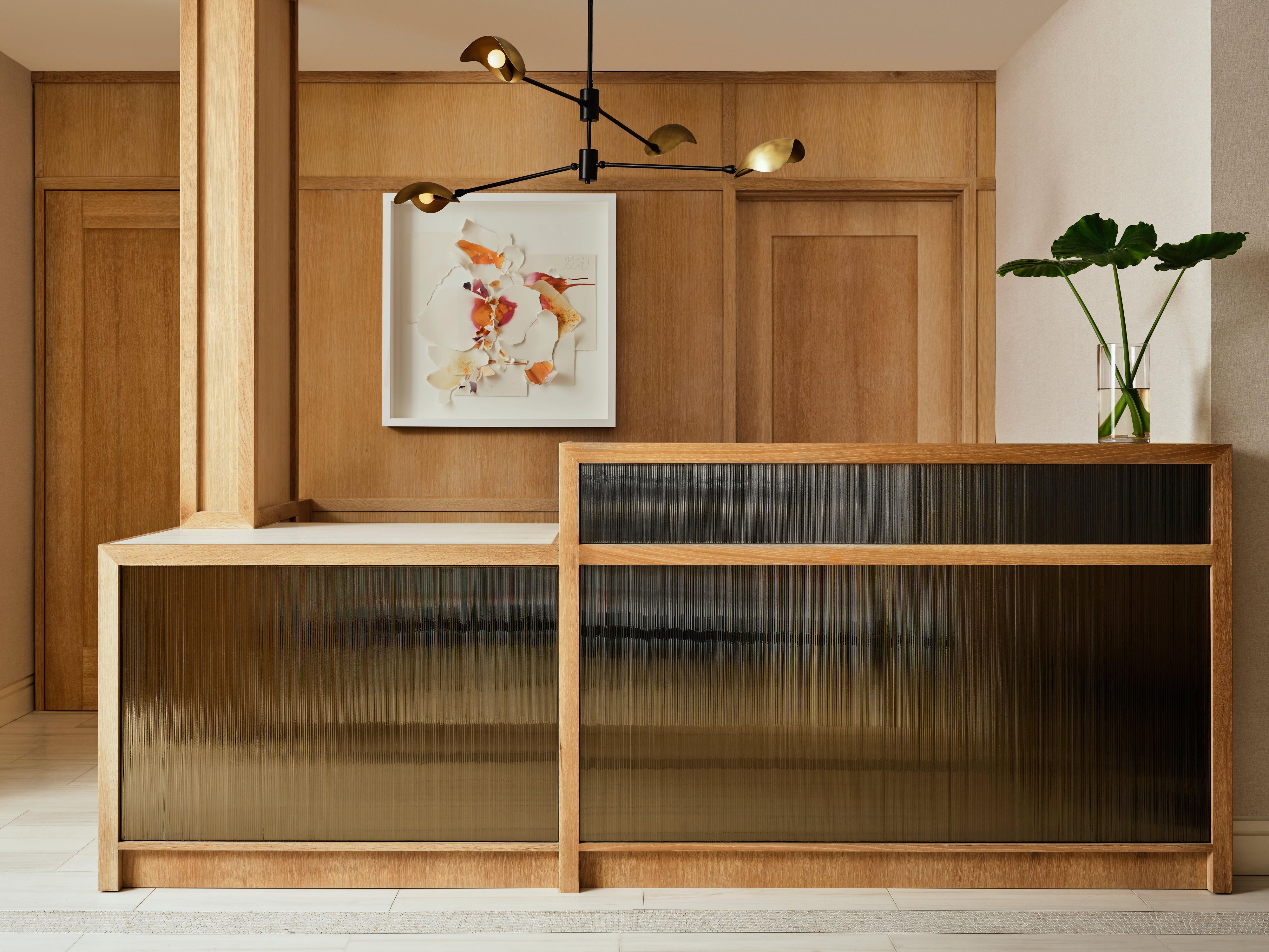 Elegant hotel reception with warm wood tones and modern design
