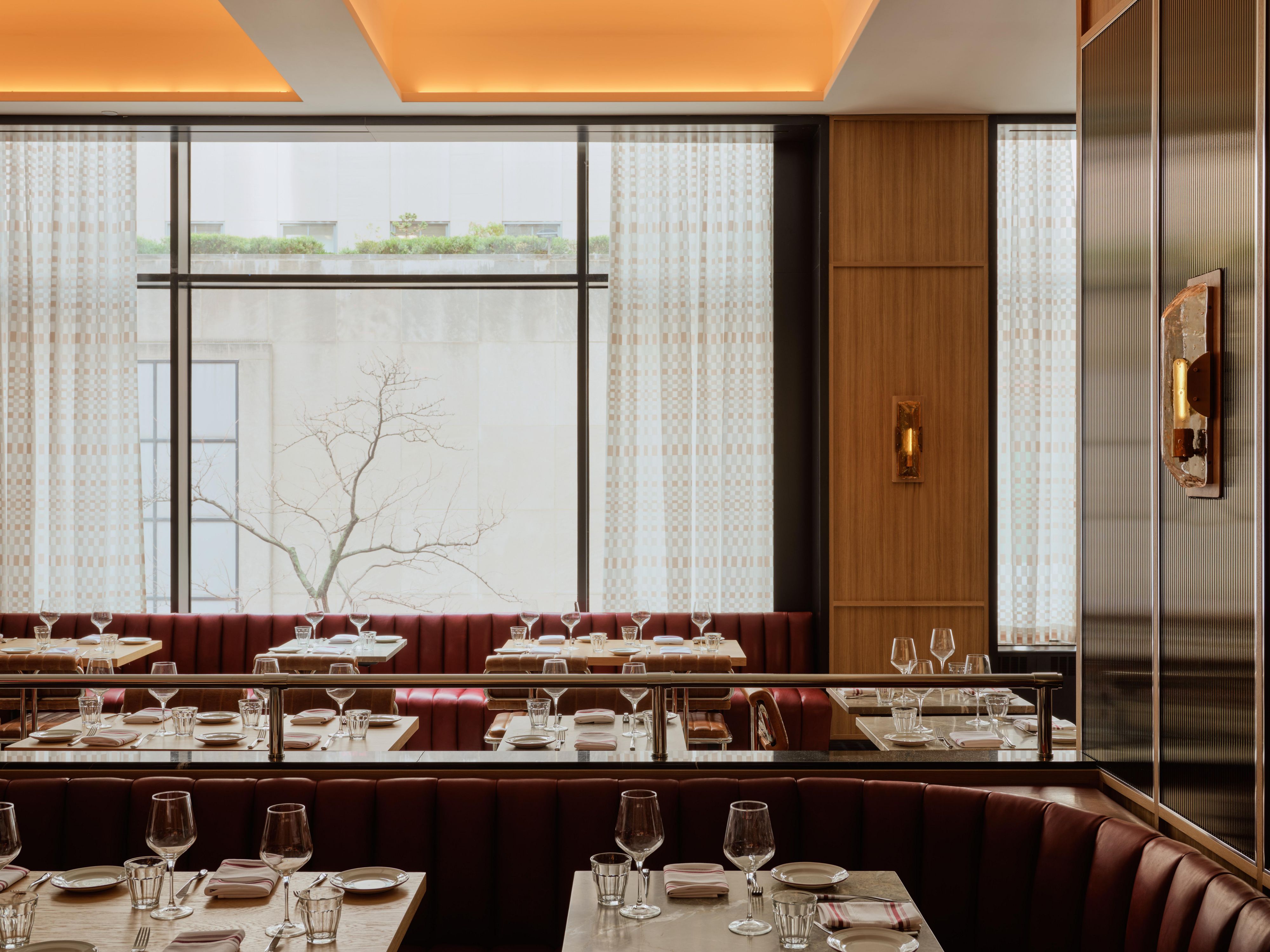 Interior of Bar Rocco with banquette seating and natural light