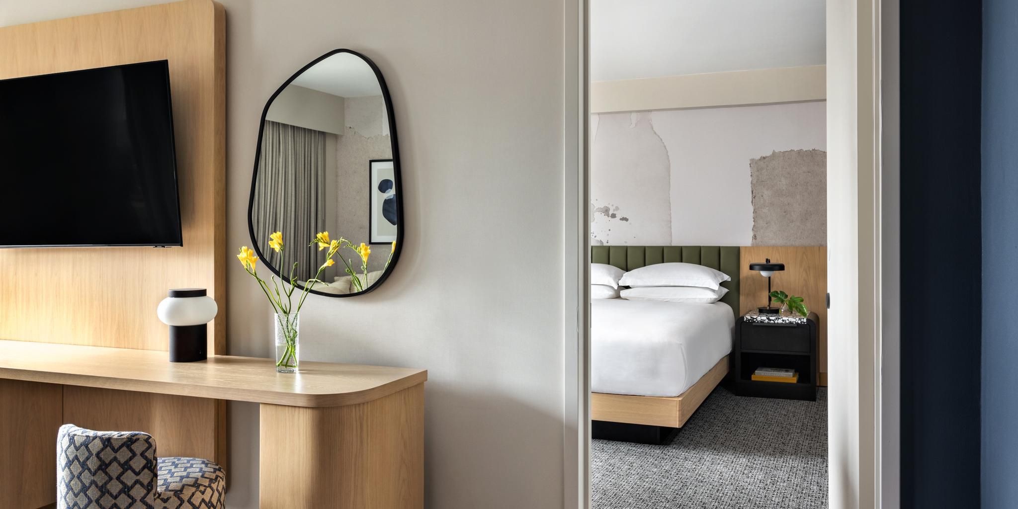 Luxury hotel suite with separate living area and king bed