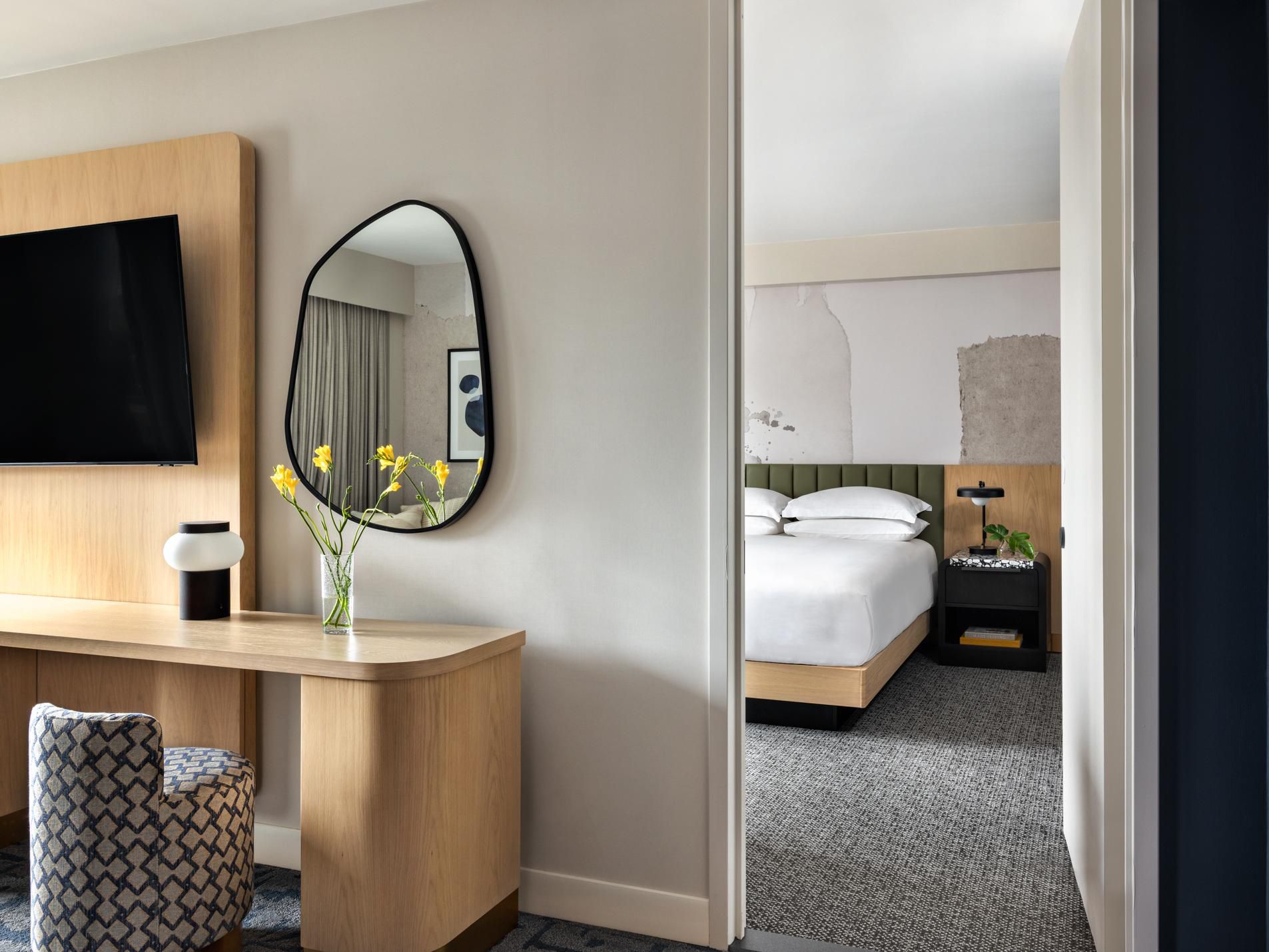 Luxury hotel suite with separate living area and king bed