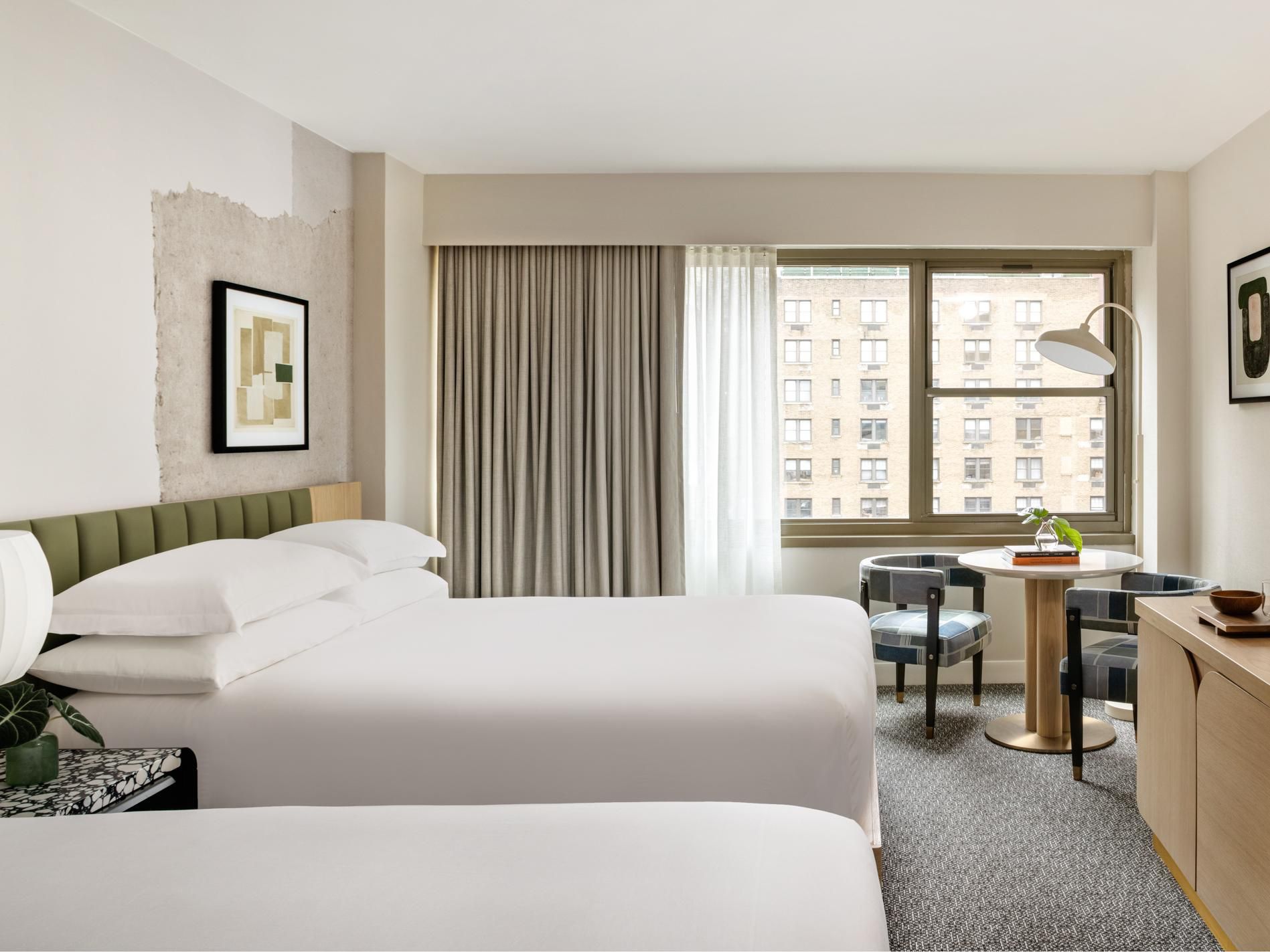 Luxury hotel room with two queen beds and premium linens