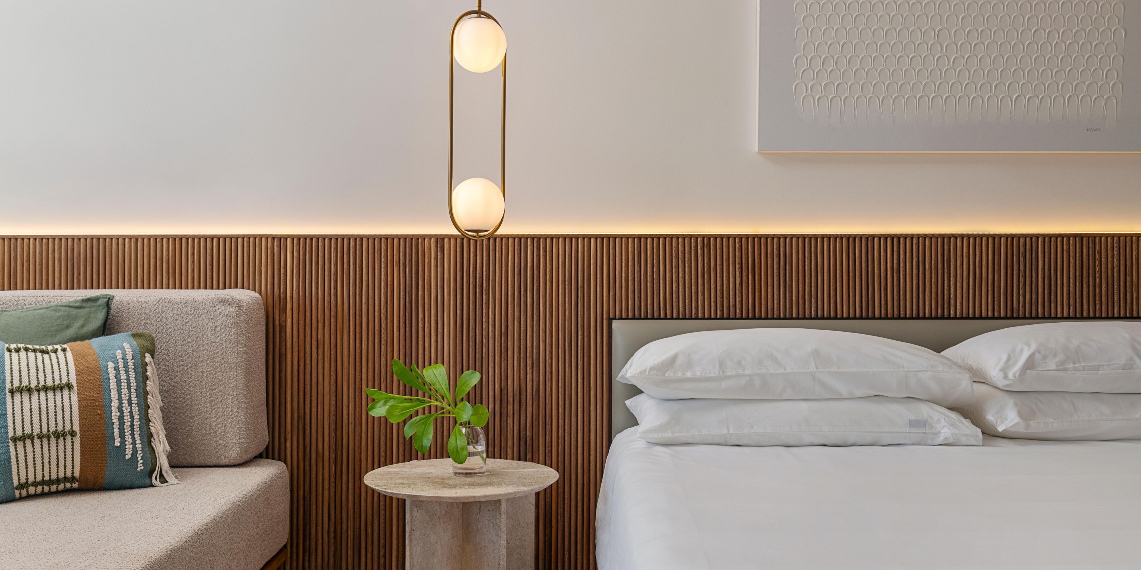 King bed with nightstand and contemporary lighting