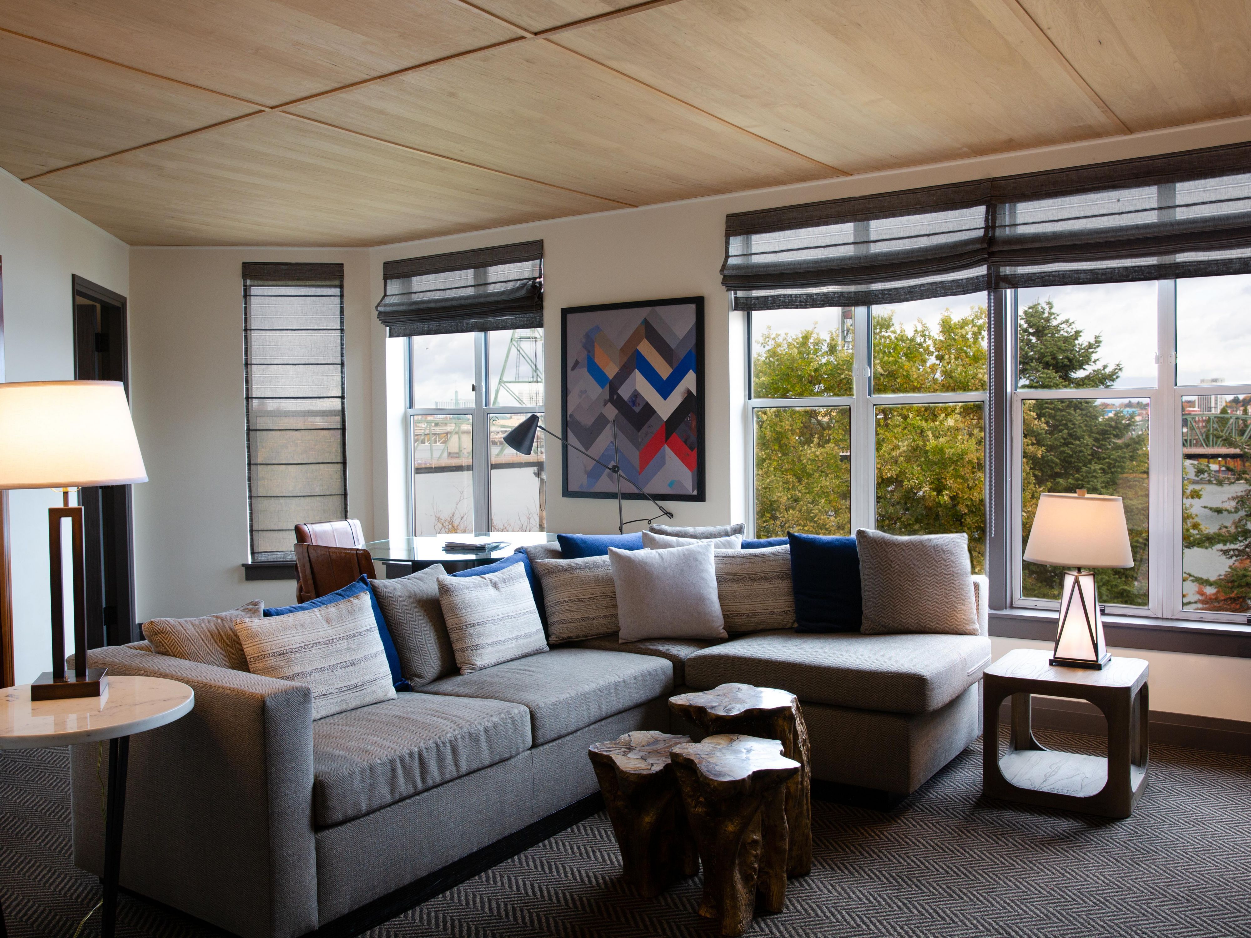Living room featuring a queen size sofa bed and stunning views