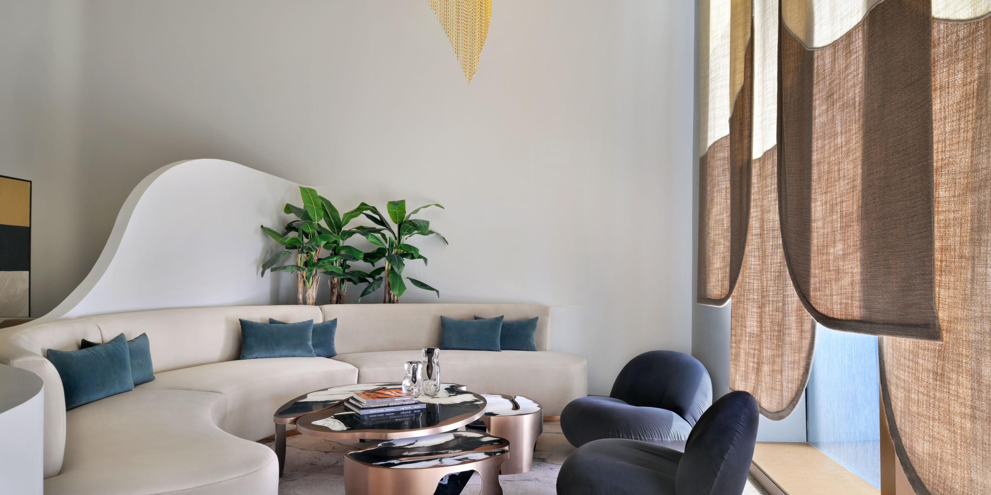 At Kimpton KAFD, our rooms and suites are your personal sanctuary. Designed with bold personality and smart details, they feature plush bedding, spacious walk-in showers, and fully stocked minibars. Unwind, recharge and refuel while enjoying captivating skyline views.