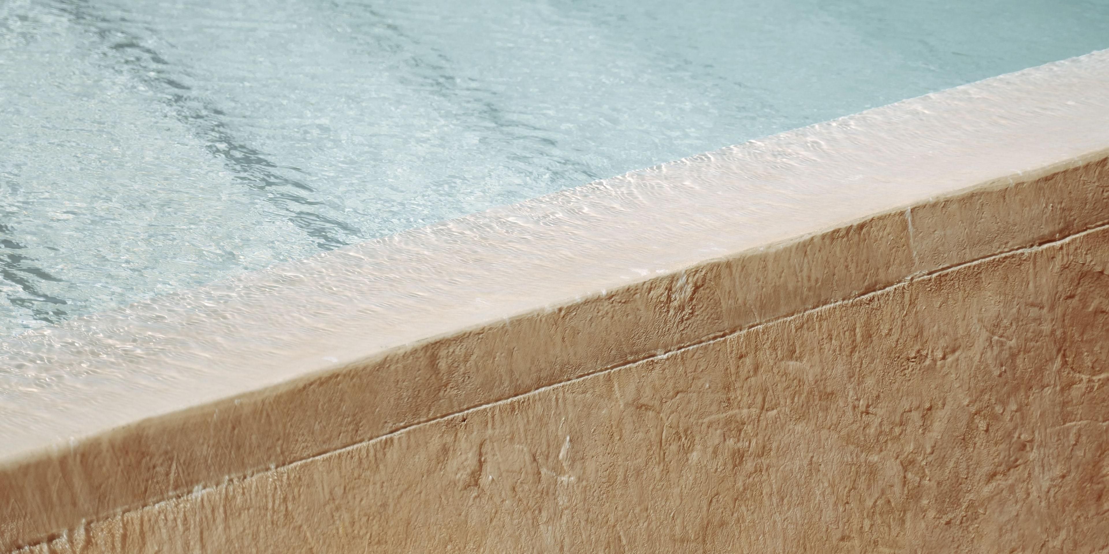 Elevate your day at the Kimpton KAFD outdoor pool, our stylish sun drenched escape. The water temperature is ideal for a refreshing dip, lounging, or simply soaking in the vibe. Dont miss our hand crafted mocktails and delicious snacks at the Kanza Pool Lounge.
