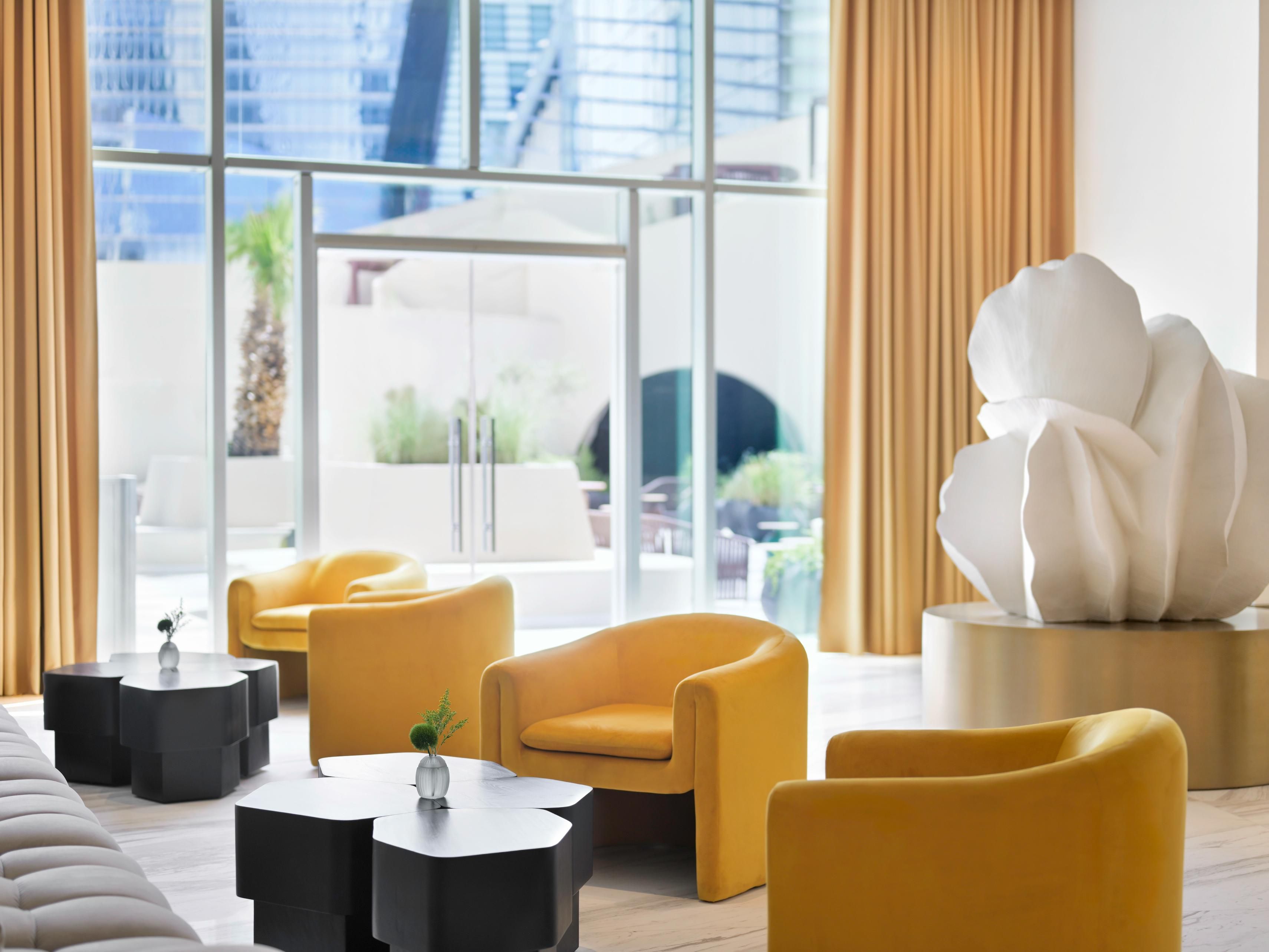 Bright, airy lobby filled with sunlight and soothing colours