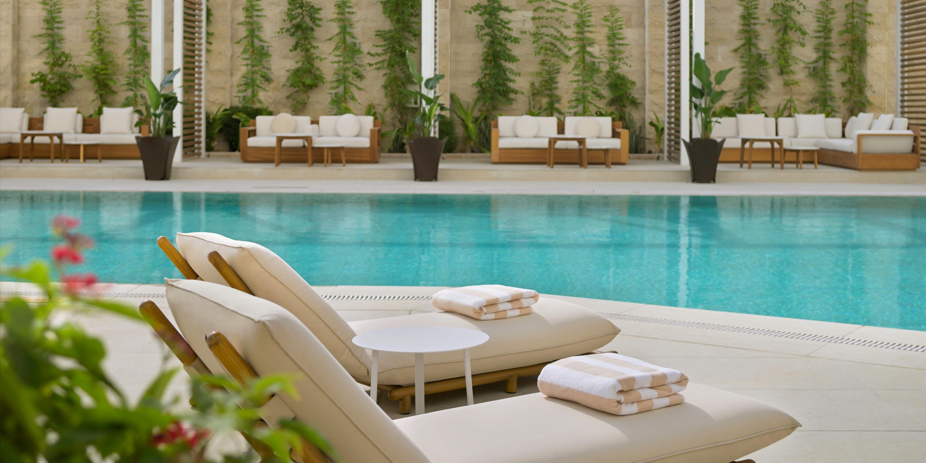 Elevate your day at the Kimpton KAFD outdoor pool, our stylish sun drenched escape. The water temperature is ideal for a refreshing dip, lounging, or simply soaking in the vibe. Dont miss our hand crafted mocktails and delicious snacks at the Kanza Pool Lounge.