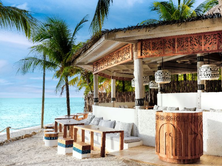 beach front bar on roatan island steps from the water's edge