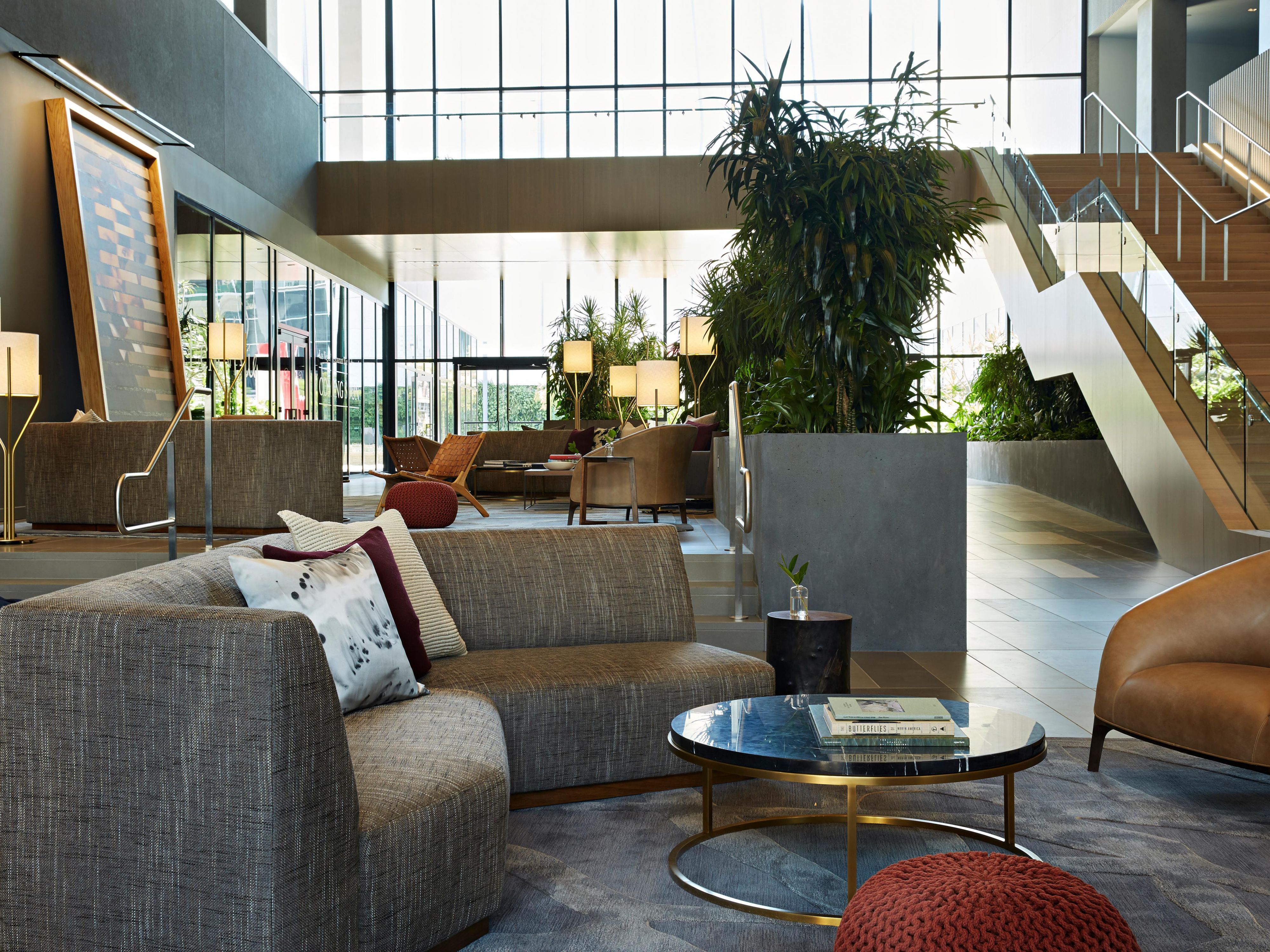 The living room opens directly onto the two-acre plaza of DOCO