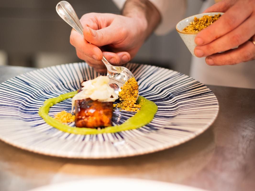 Chef preparing a gourmet plate 
