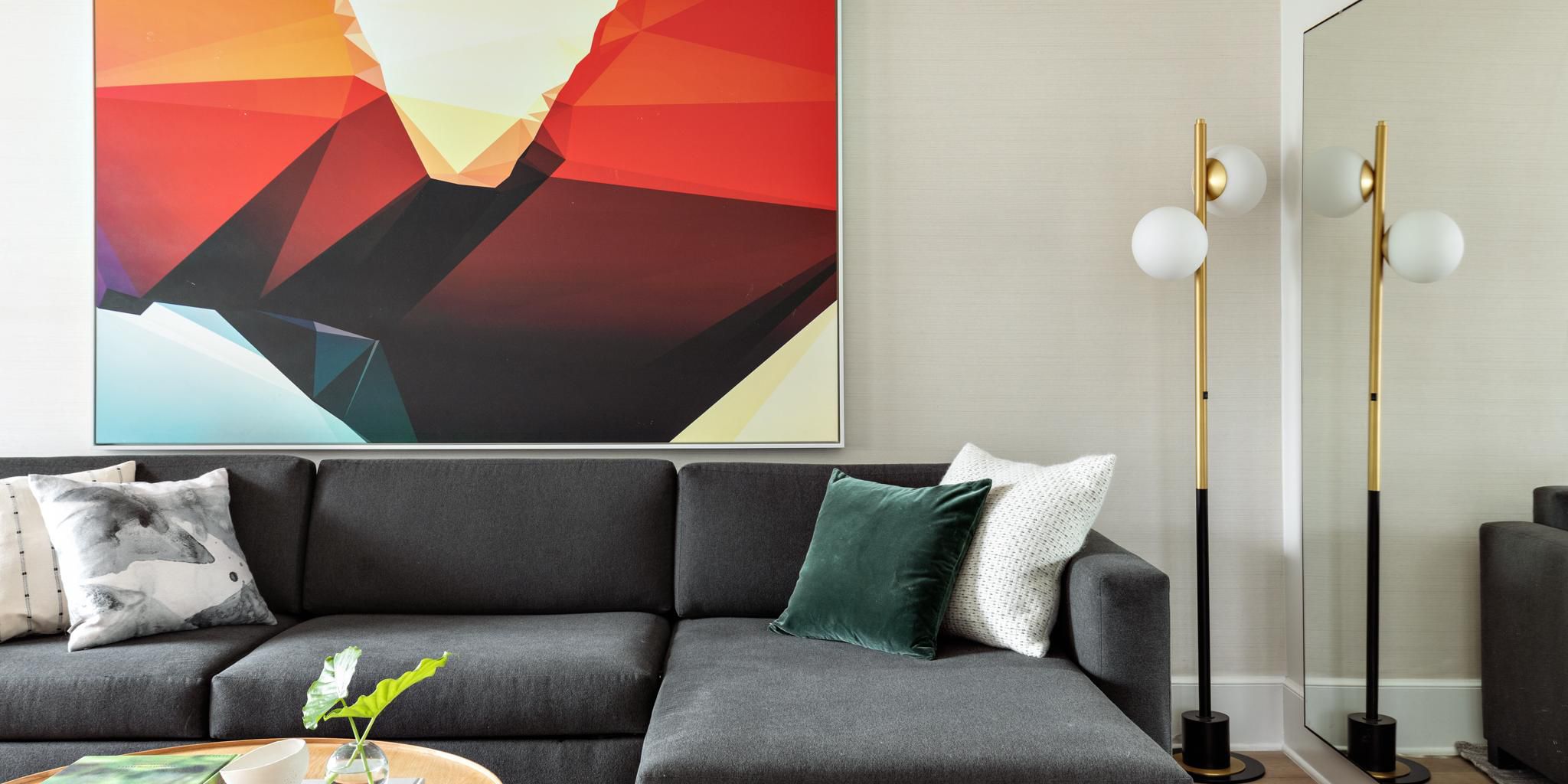 Enjoy a plush living room area in our 2 Queen 1 Bedroom Suite