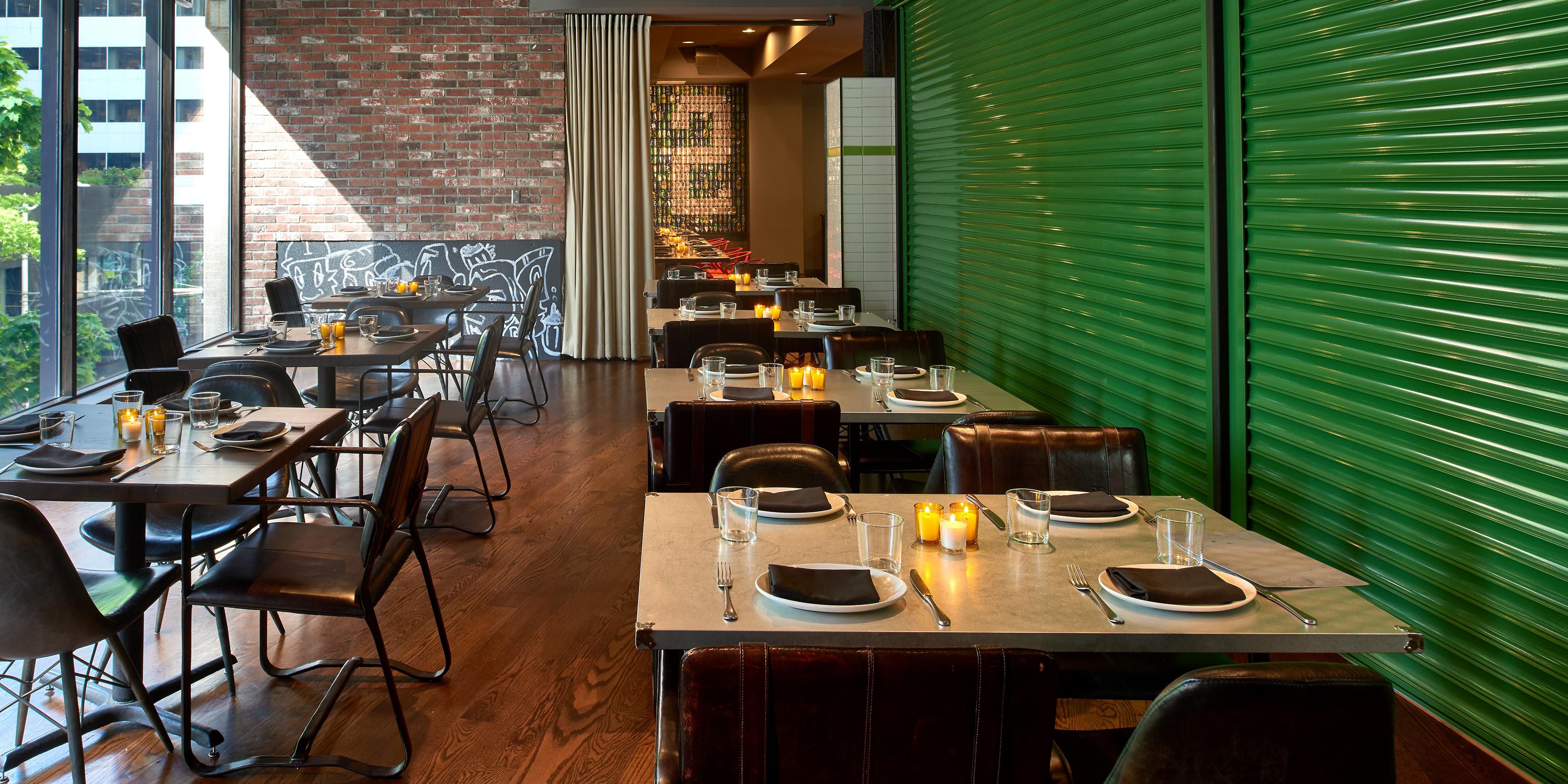 Our downtown restaurant, Outlier, features The Garage: a perfect space for your group of up to 40 guests for a seated meal or 60 of your closest friends for a reception hidden behind huge green doors. The Garage also features floor to ceiling windows with plenty of natural light.
