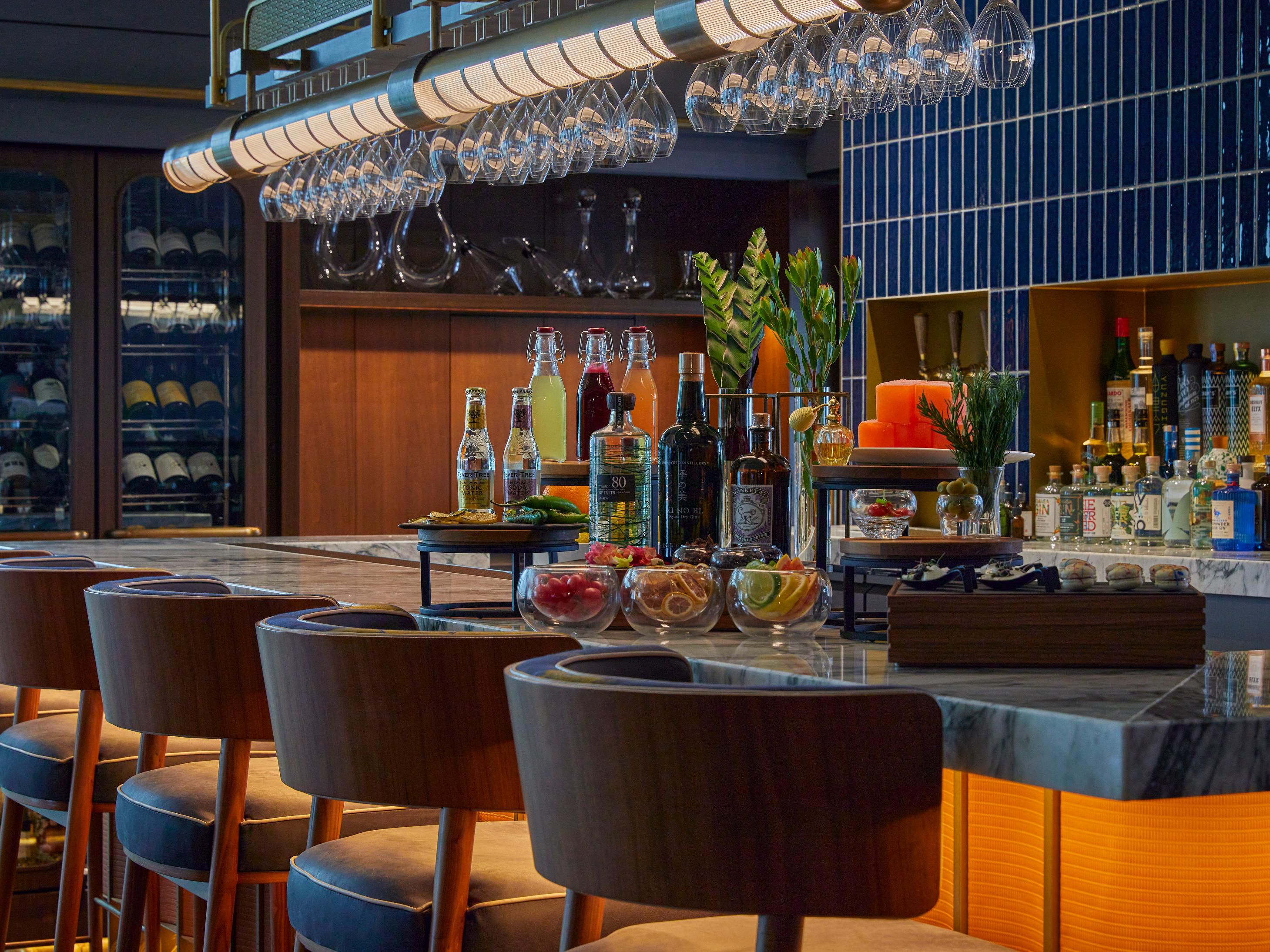 Come sip signature cocktails at District - Brasserie, Bar, Lounge