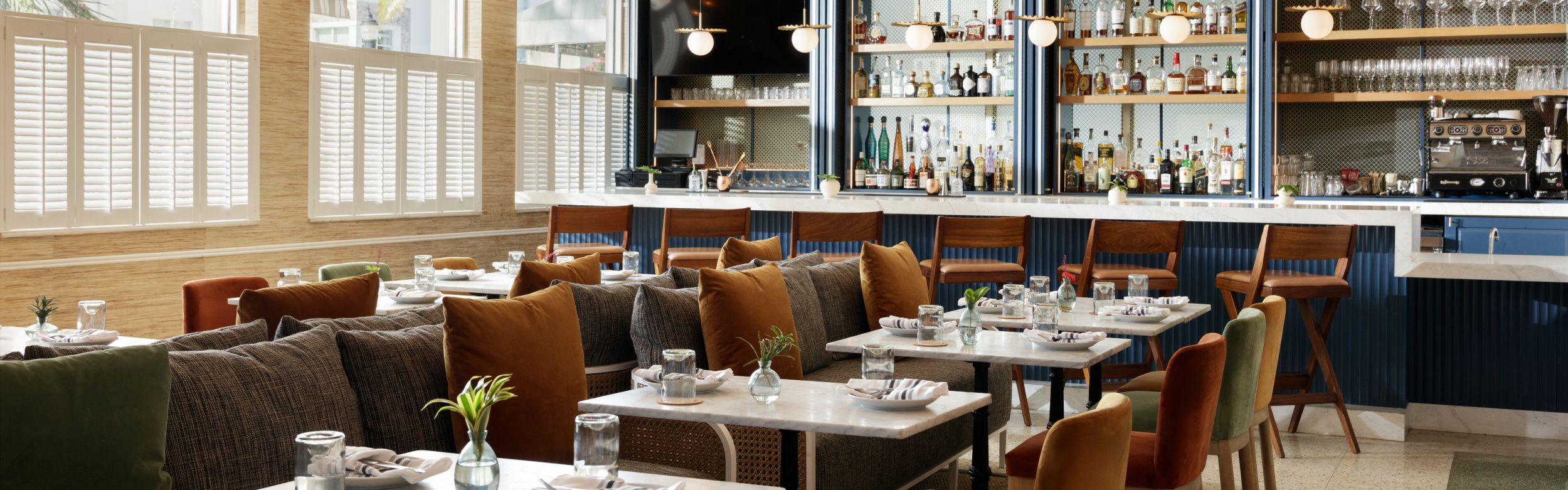 restaurant with set tables and full bar