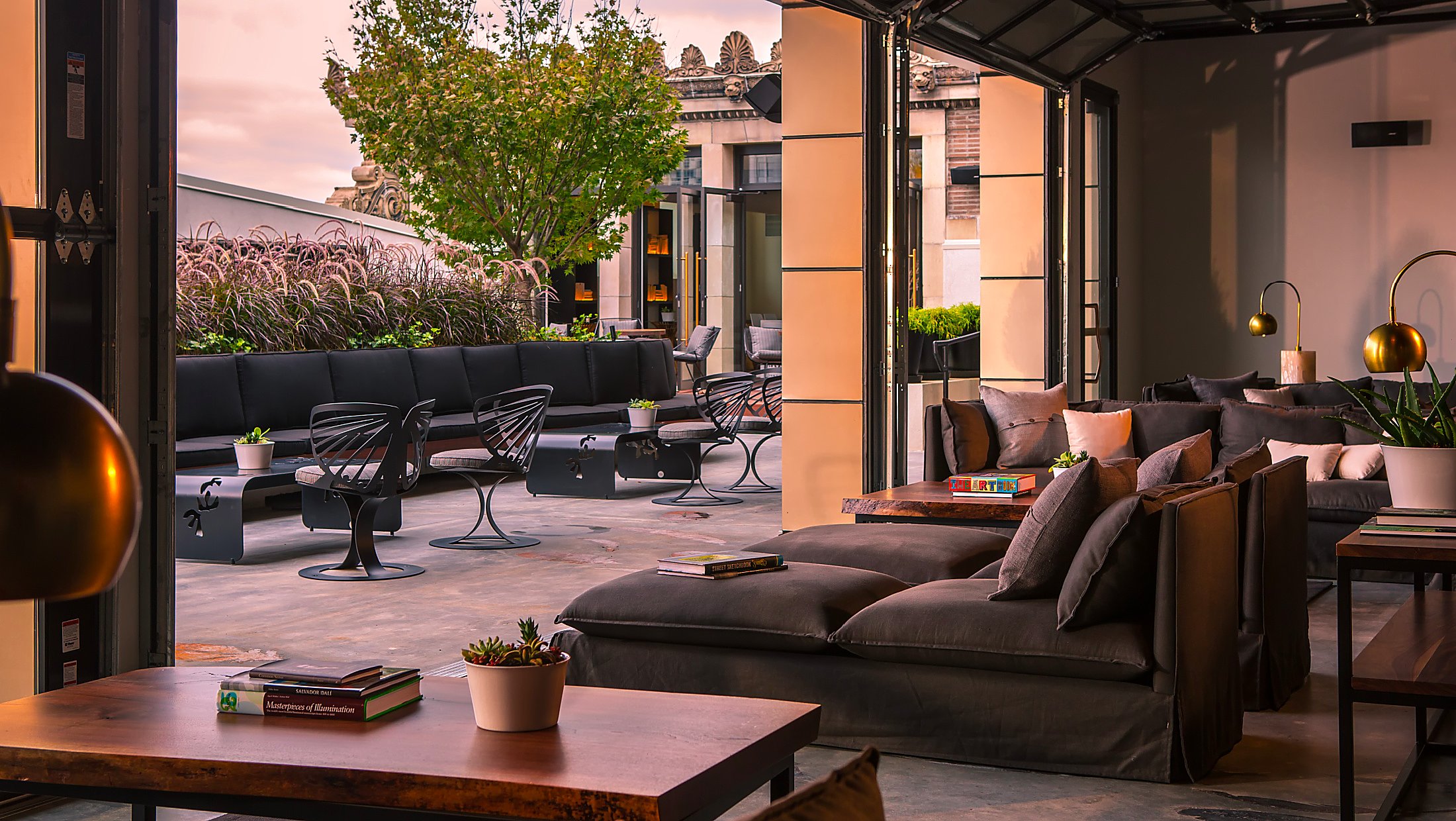 chic indoor/outdoor launge area at dusk