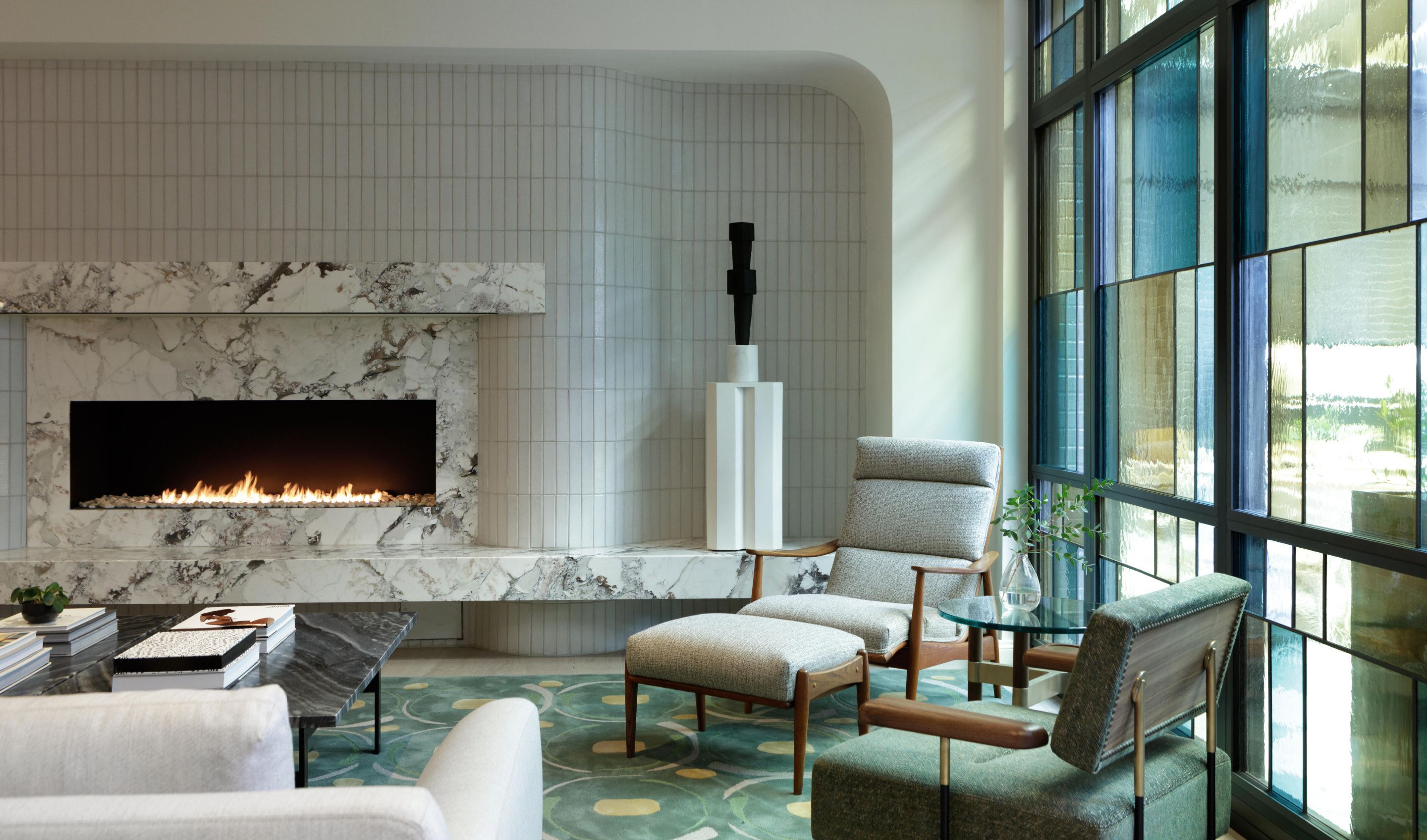 Lobby with stained glass windows and marble fireplace