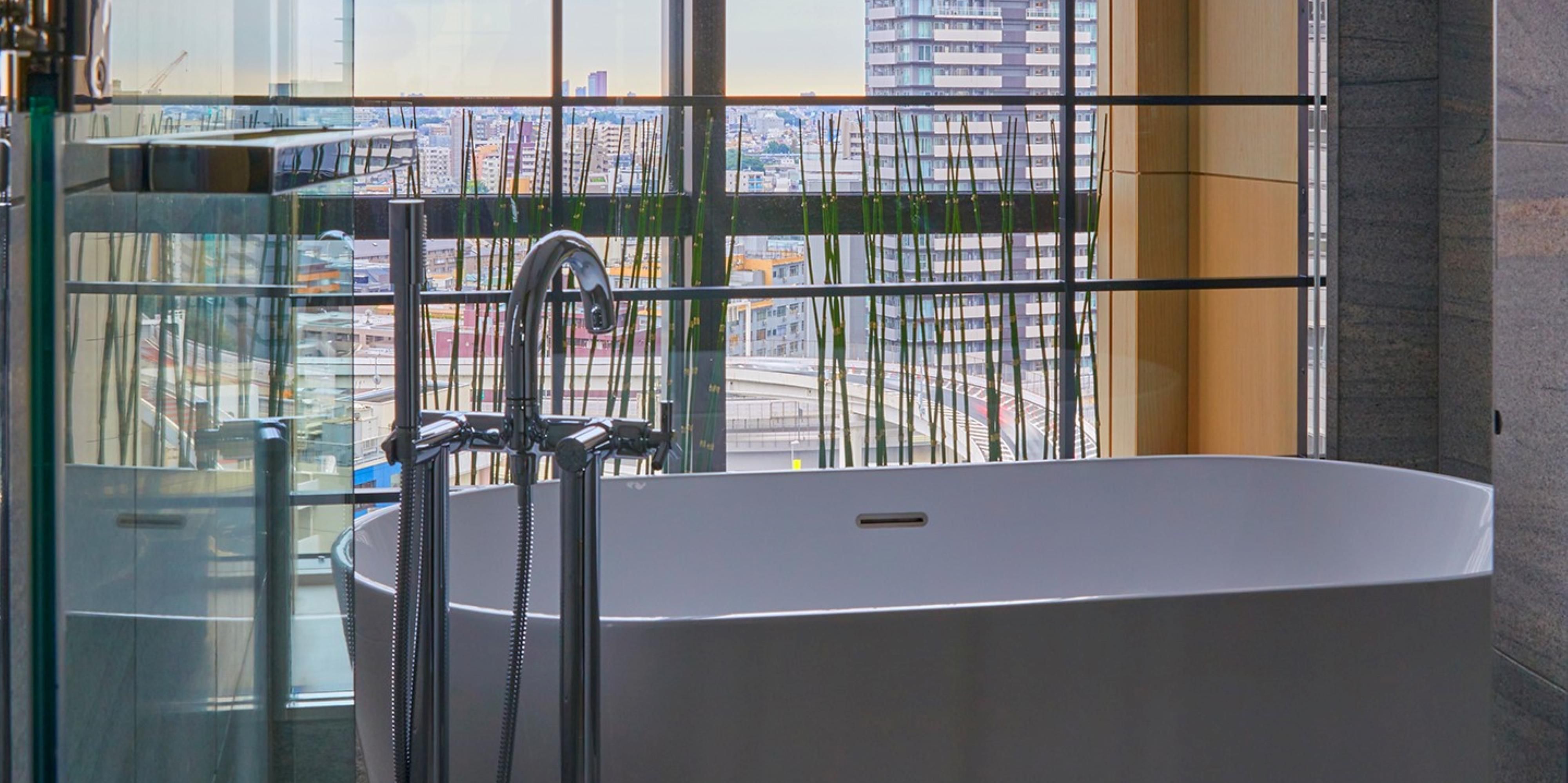 Lavish bath with window overlooking the city of Tokyo