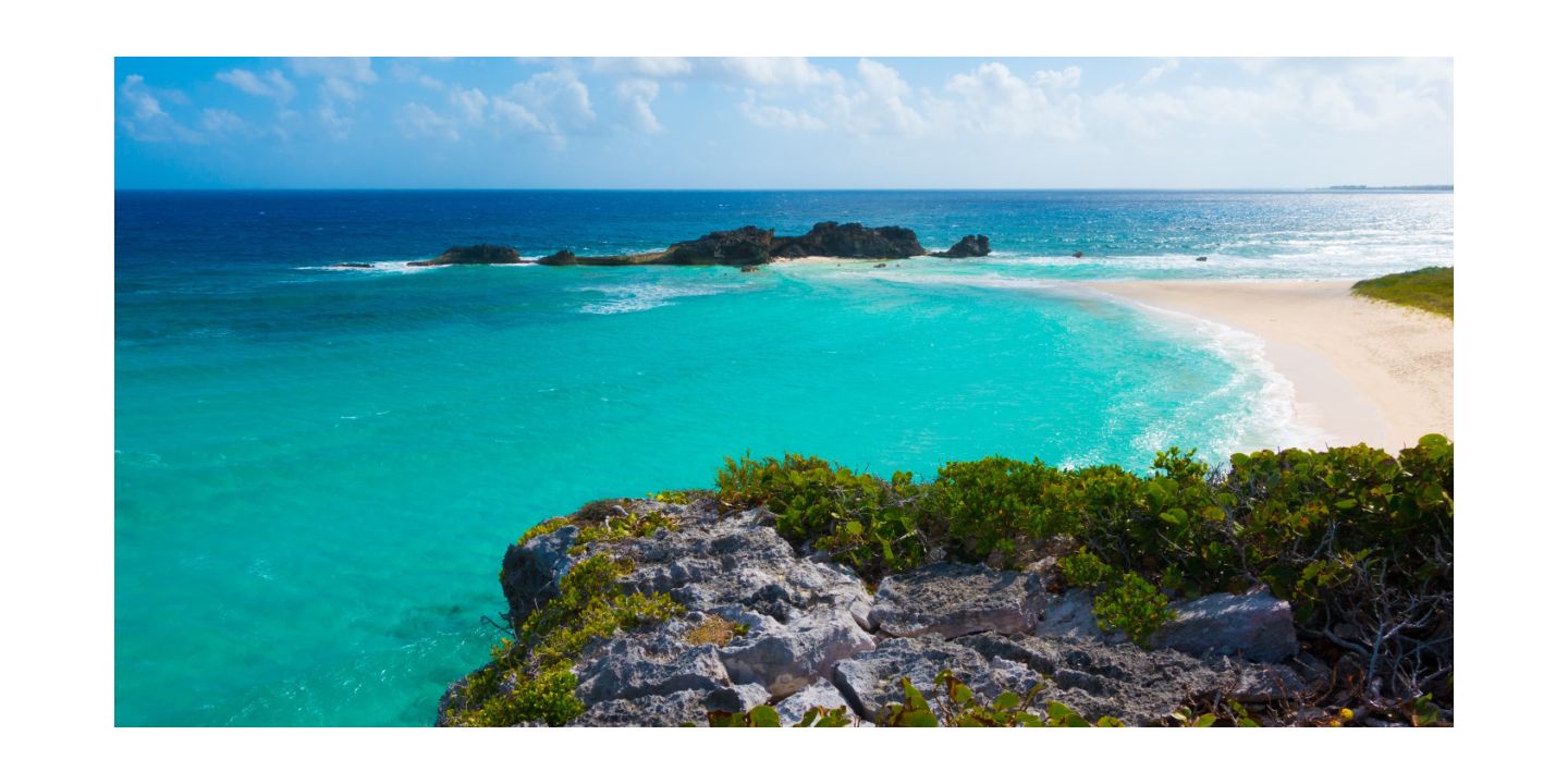 Aqua blue waters of the caribbean viewed from a pristine beach