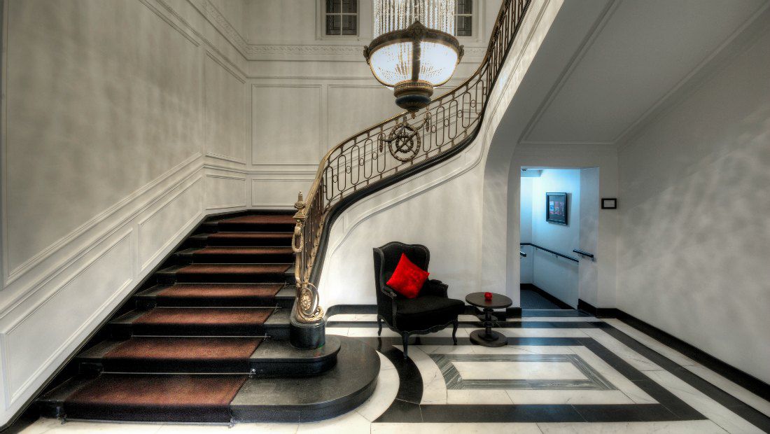 a grand hotel common area with a large staircase