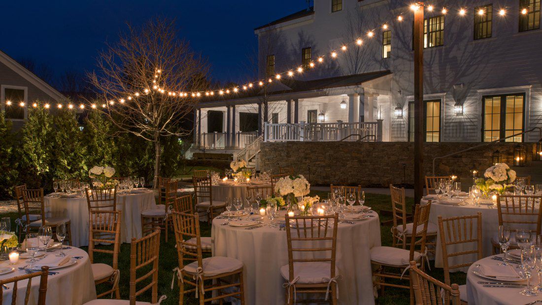 an outdoor dining area at dusk