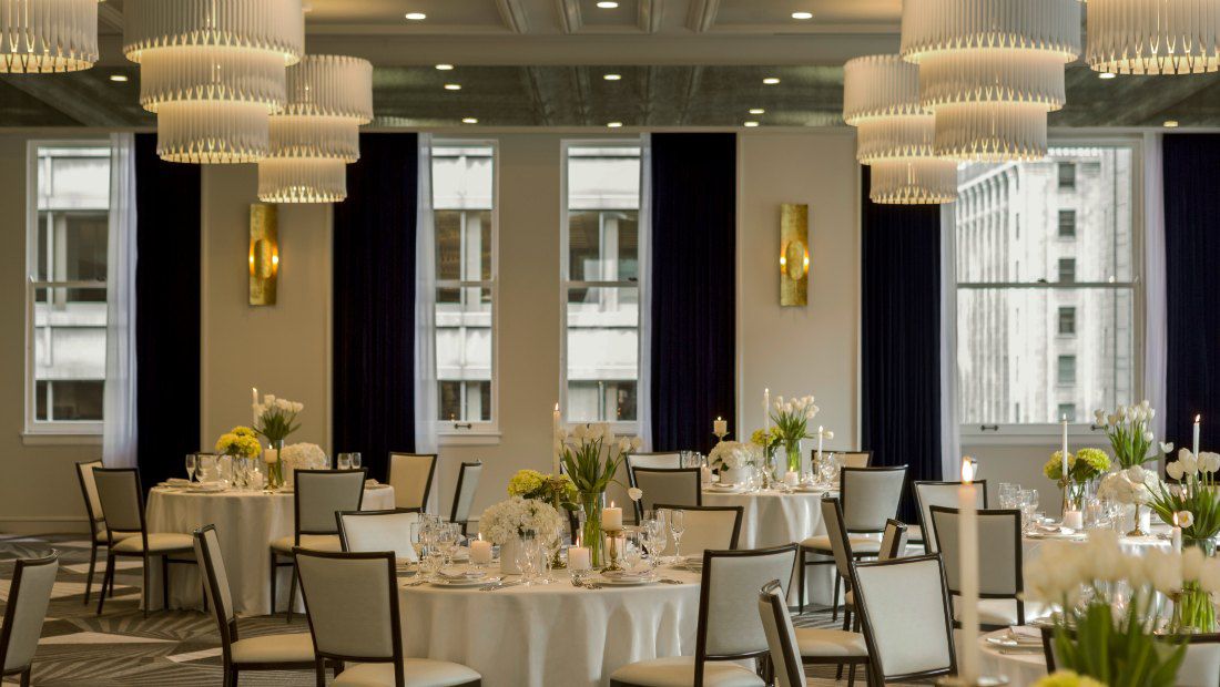 a large dining room with atmospheric lighting and ornate decor