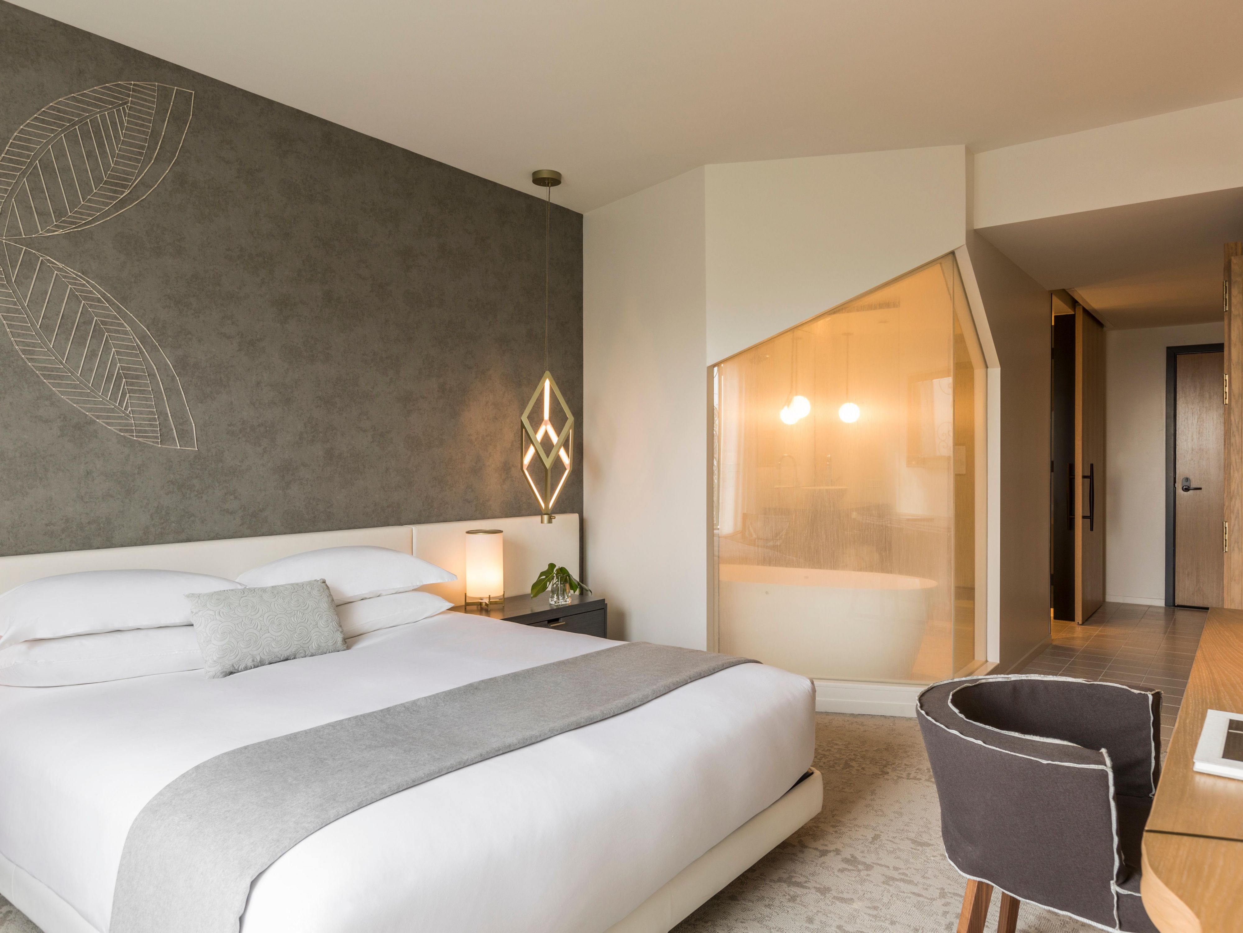 Select rooms feature a deep-soaking tub and a separate rain shower