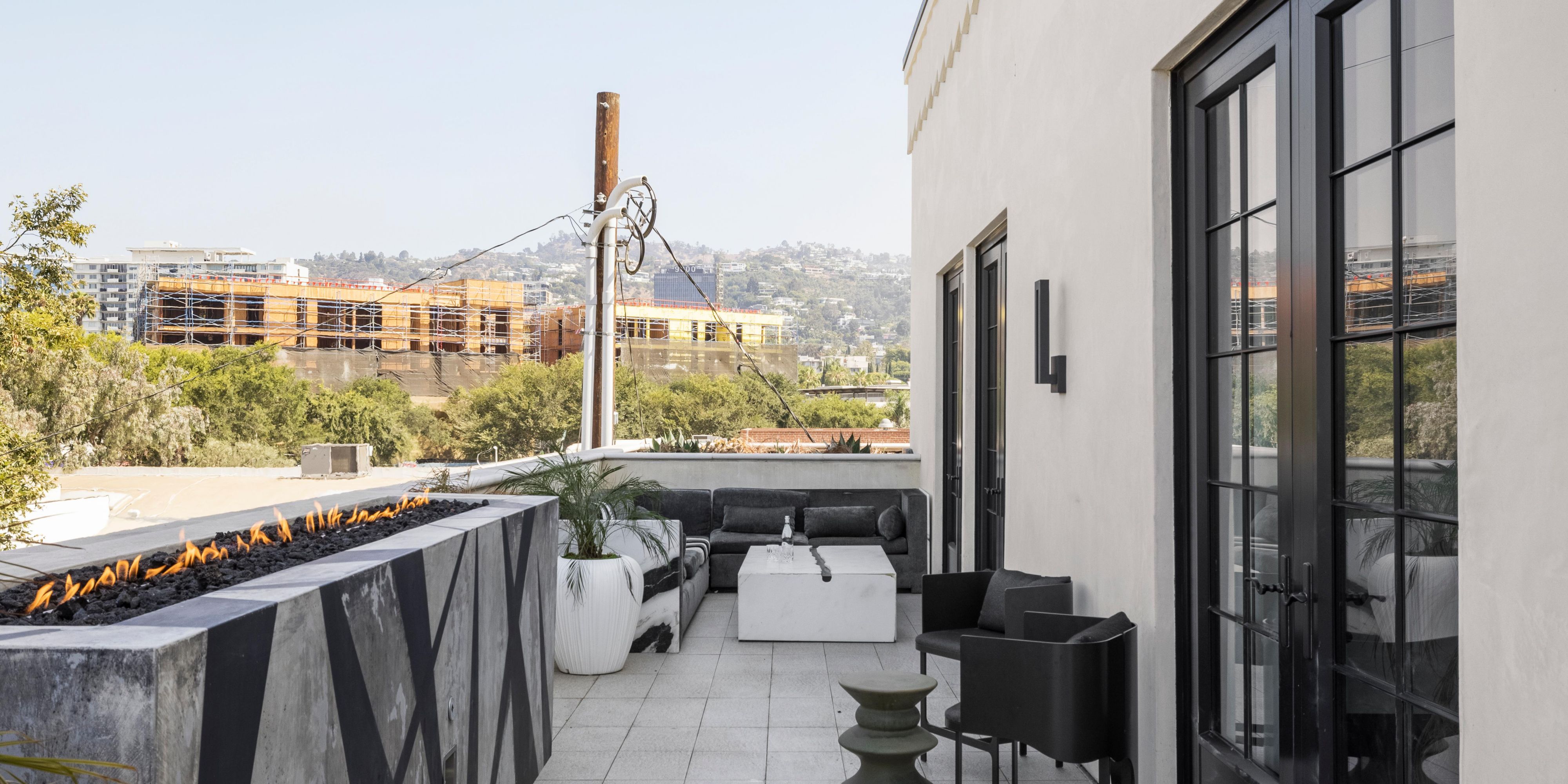 Spacious 200 sqft private terrace with pool views and fire pit
