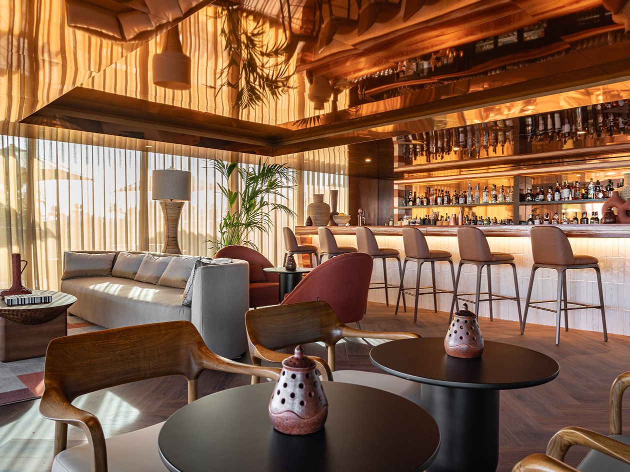 modern bar and lounge with tall ceilings