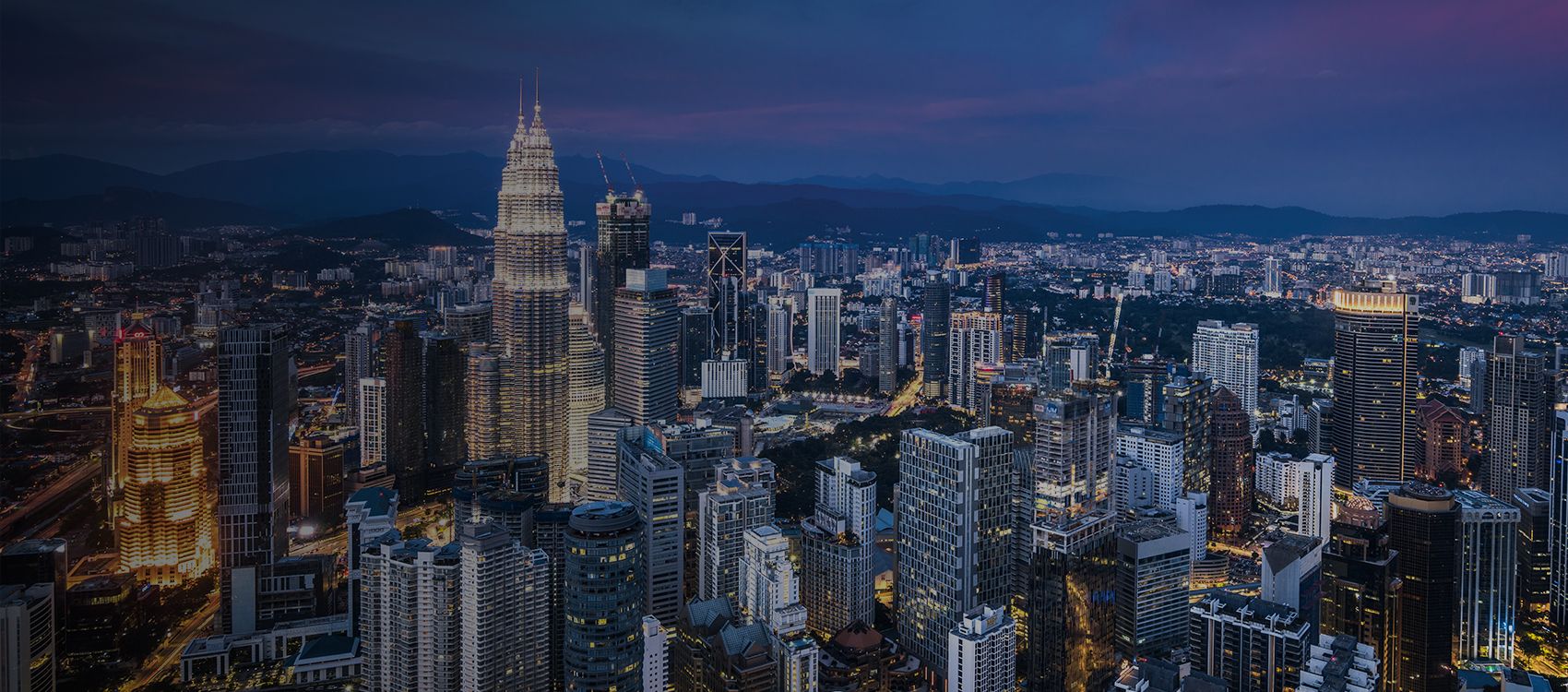 view for miles across capital of kuala lumpur with towering skyscrapers