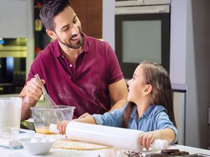 Father and daughter in kitchen 
