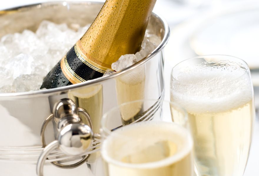 chilling bottle of bubbles with champagne flutes