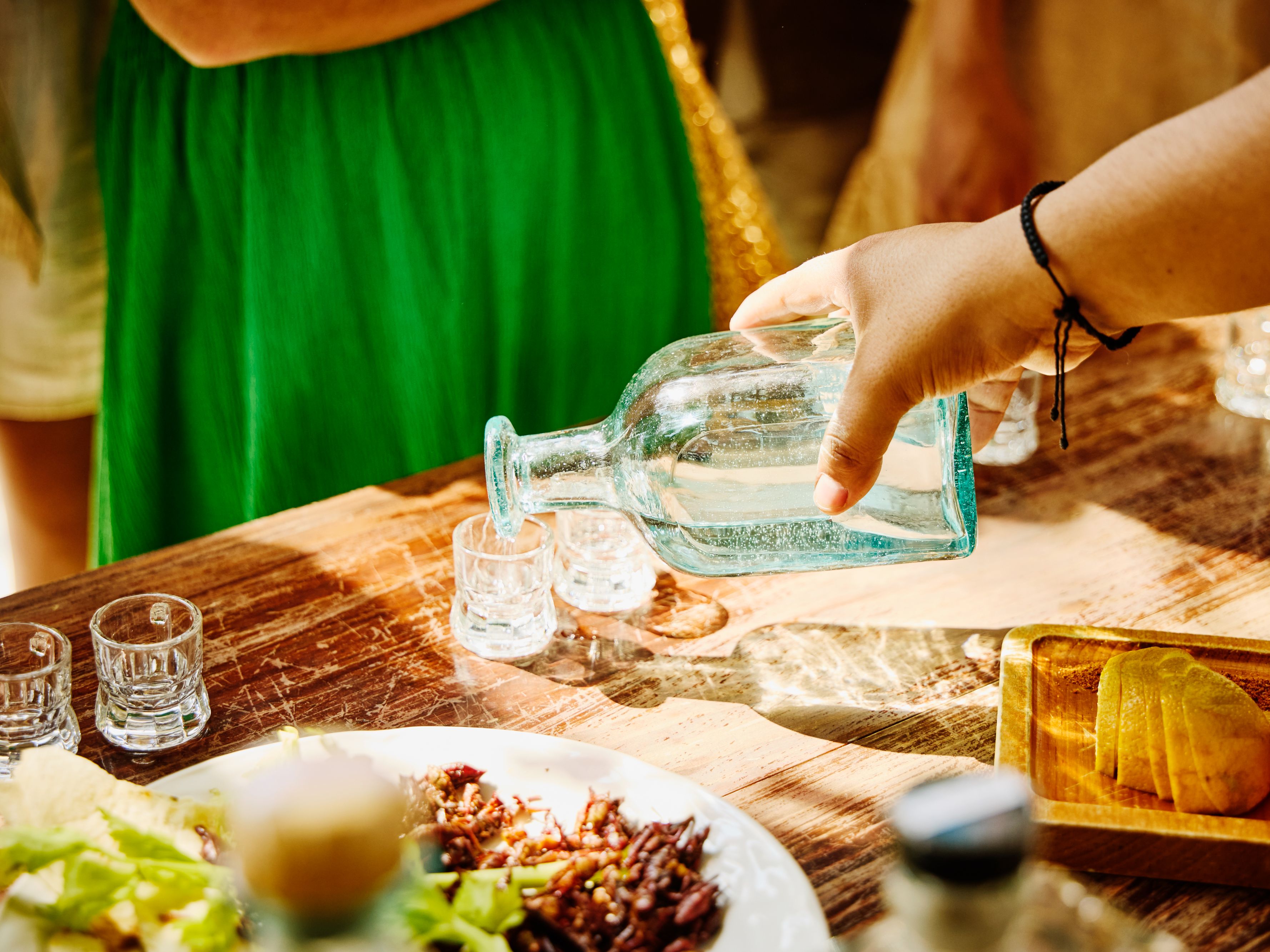 Mezcal being poured for a tasting.