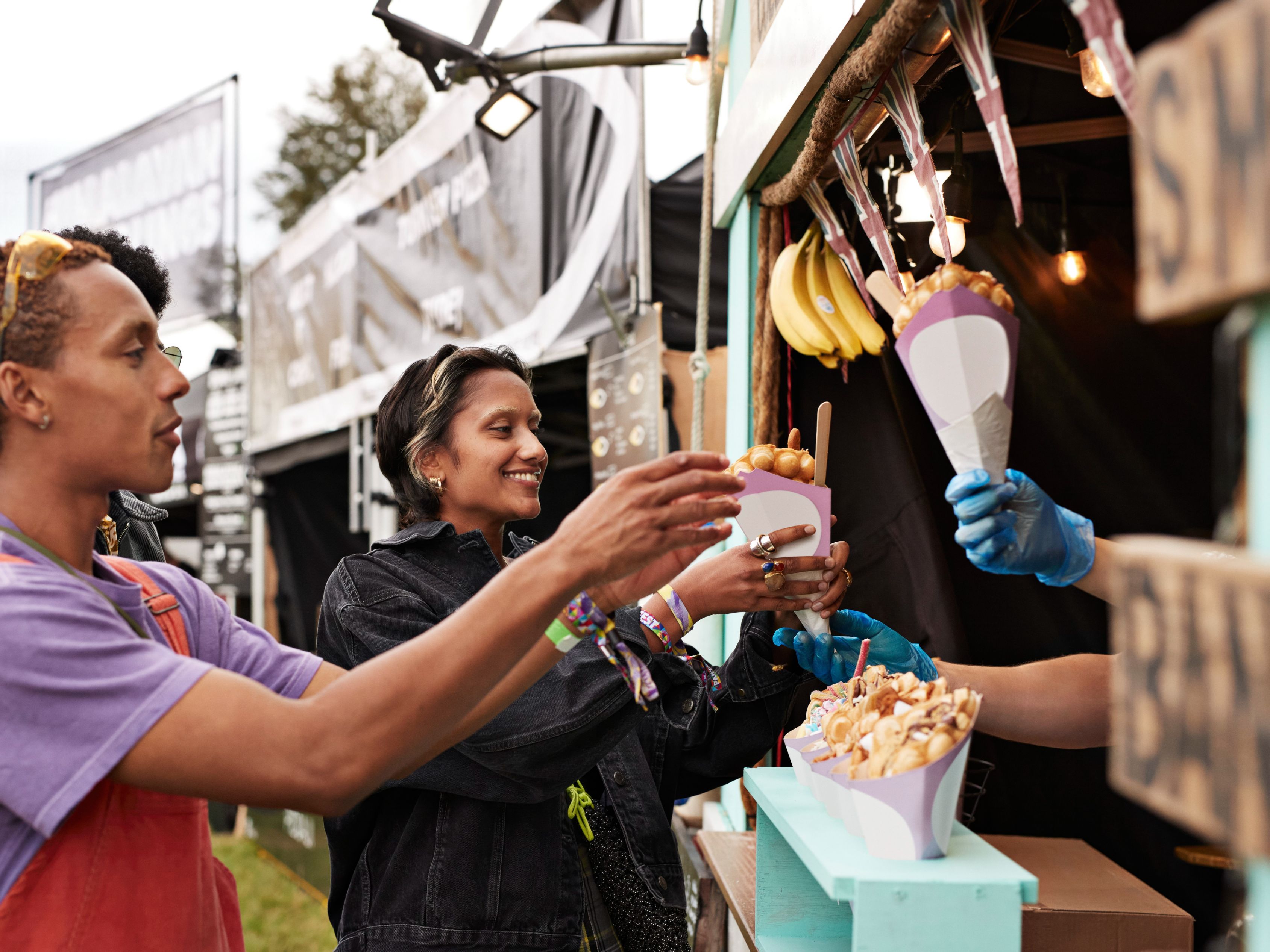 Friends getting food from a vendor