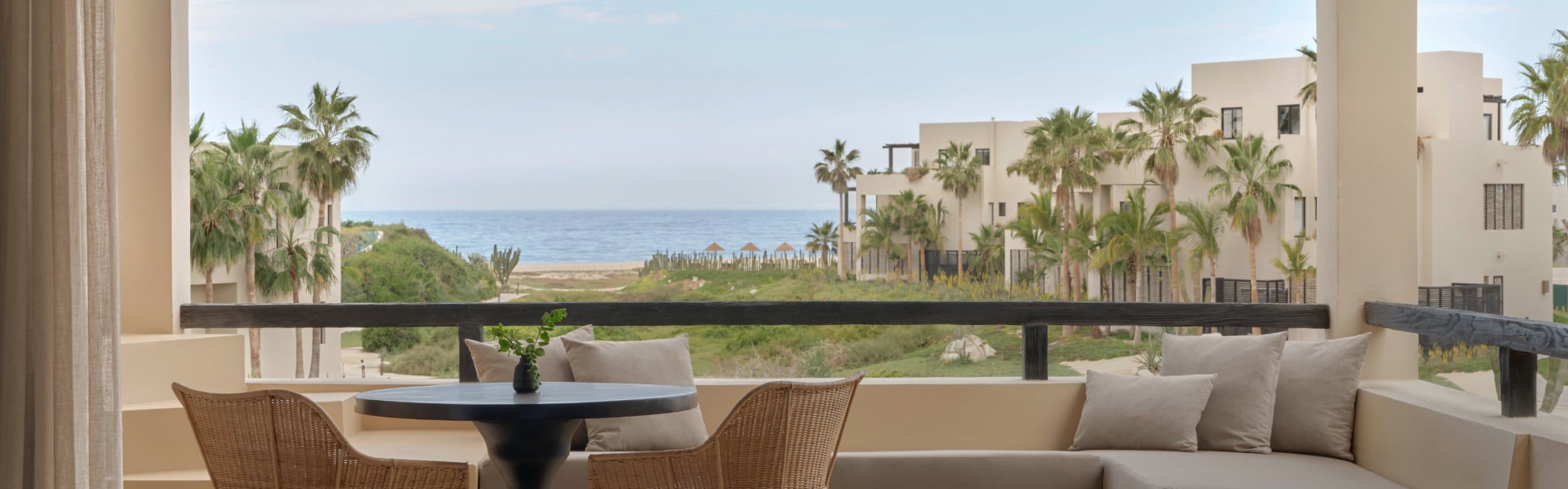 Palm‑framed ocean view at Kimpton Mas Olas