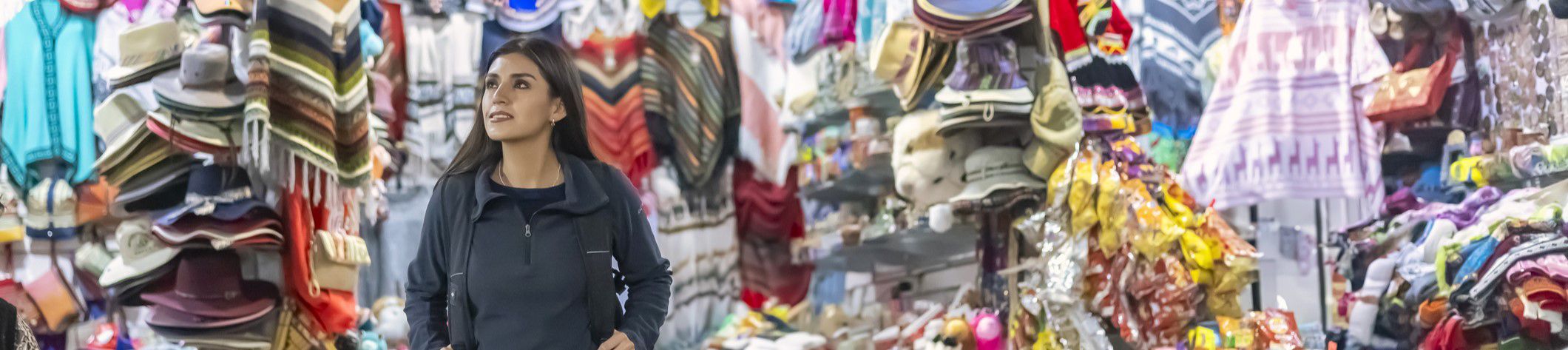 Guest shopping for clothing in Peruvian market