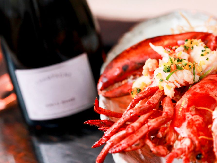 Lobster meal with a glass of champagne