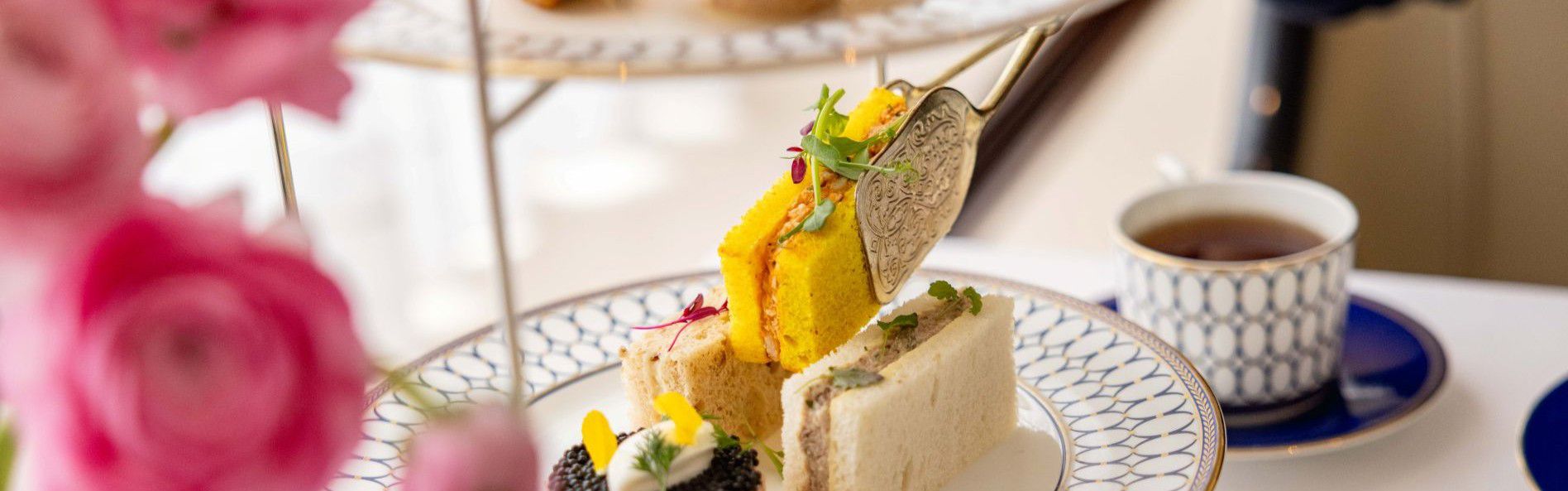 afternoon tea with sandwiches, tea and delights