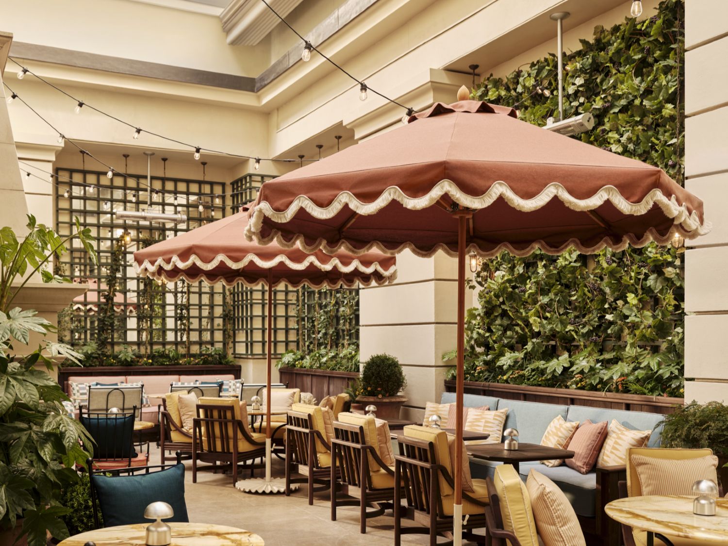 the terrace featuring empty tables and chairs on a patio area