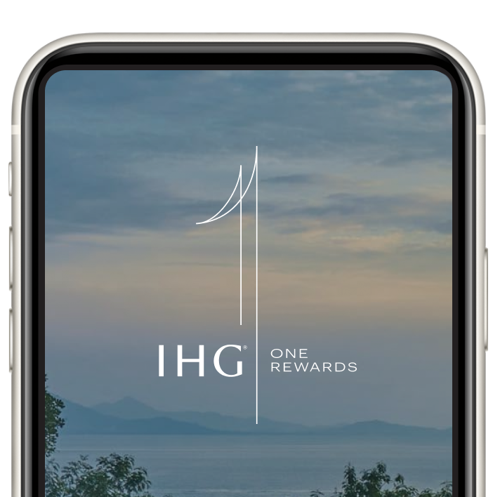 Image of a smartphone with the new IHG One Rewards app screen in view