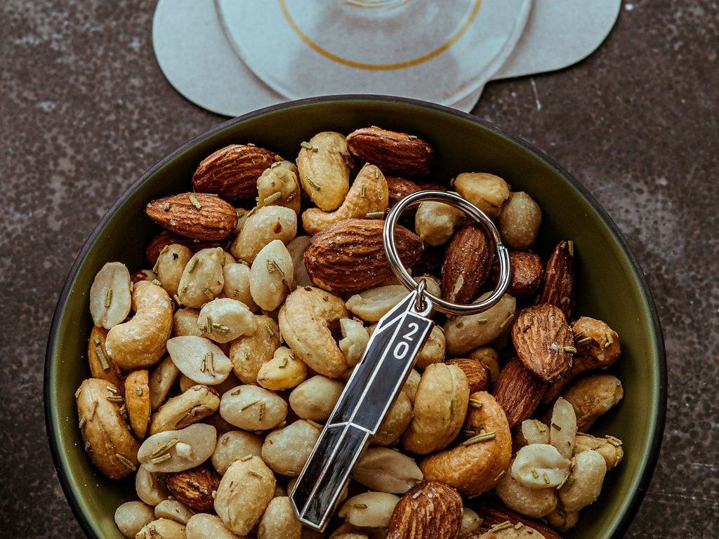 bowl of nuts with a keyring with number 20 on it