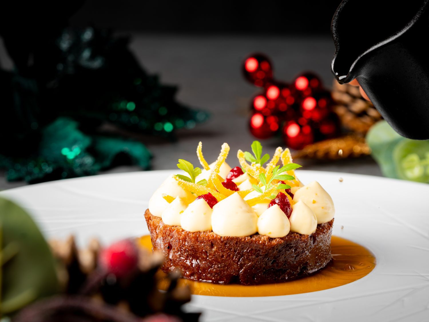 podium dessert with sauce being poured over