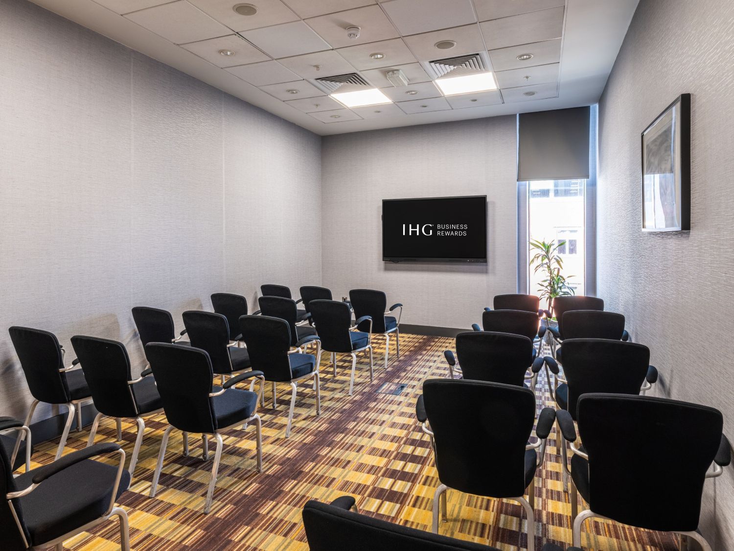 Large events venue with stage and many chairs