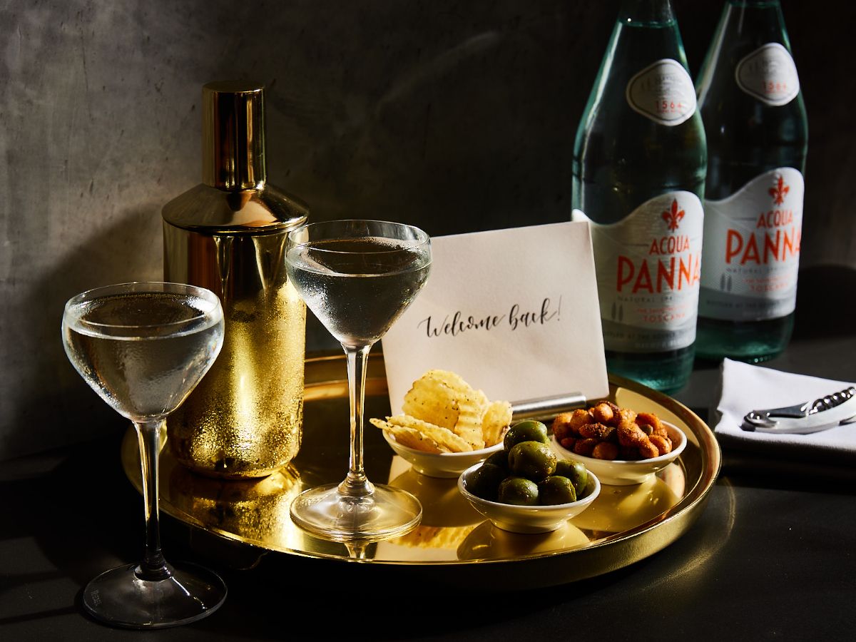 Martini with a sign that says "welcome back"