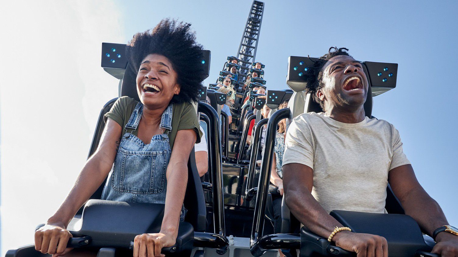 Guests on the Jurassic World Velocicoaster