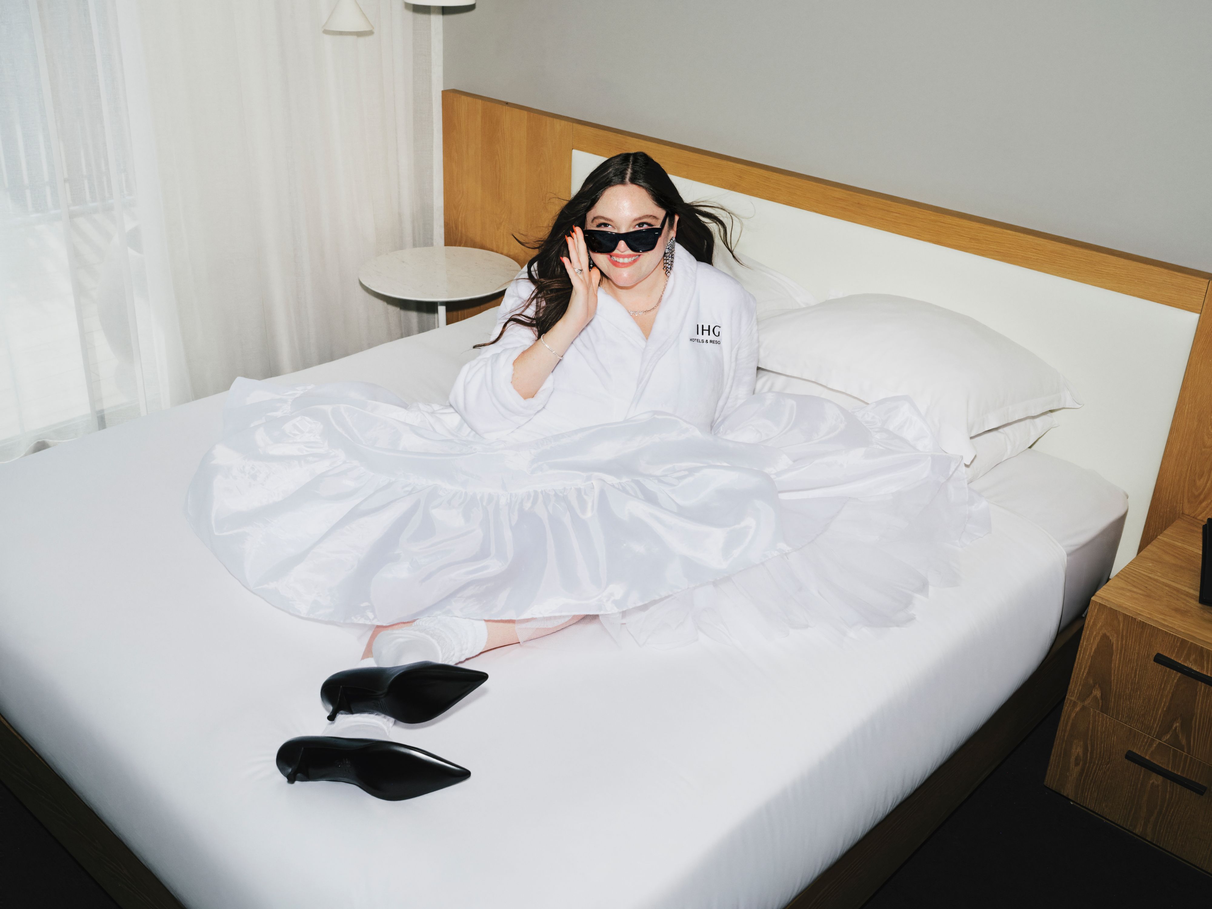 Woman on hotel bed