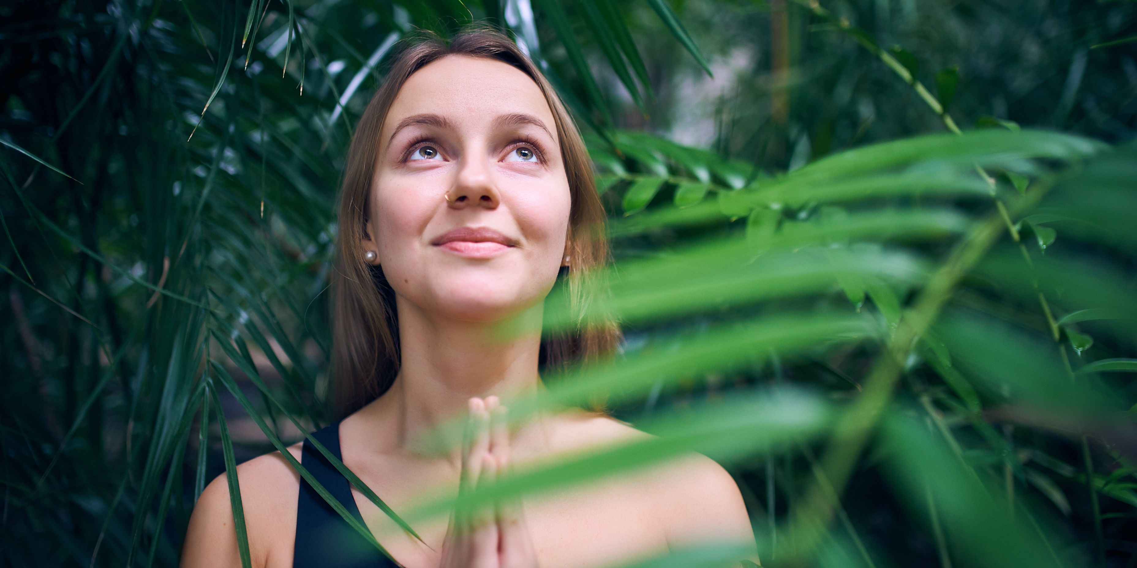 Guest among lush tropical plants in the hidden garden.